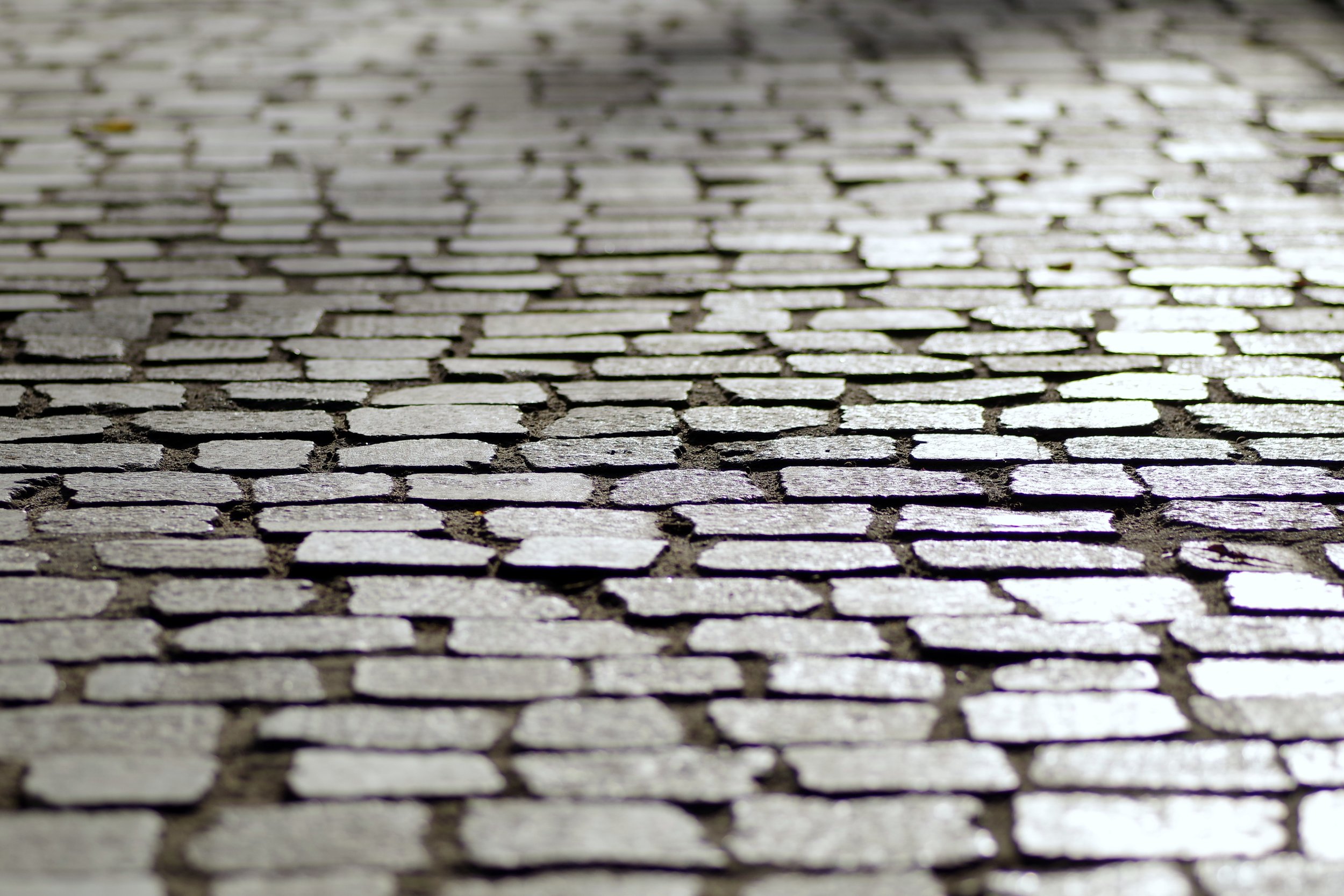 Green, porous, and cool sidewalk pavers mitigate urban heat and flood risk. 