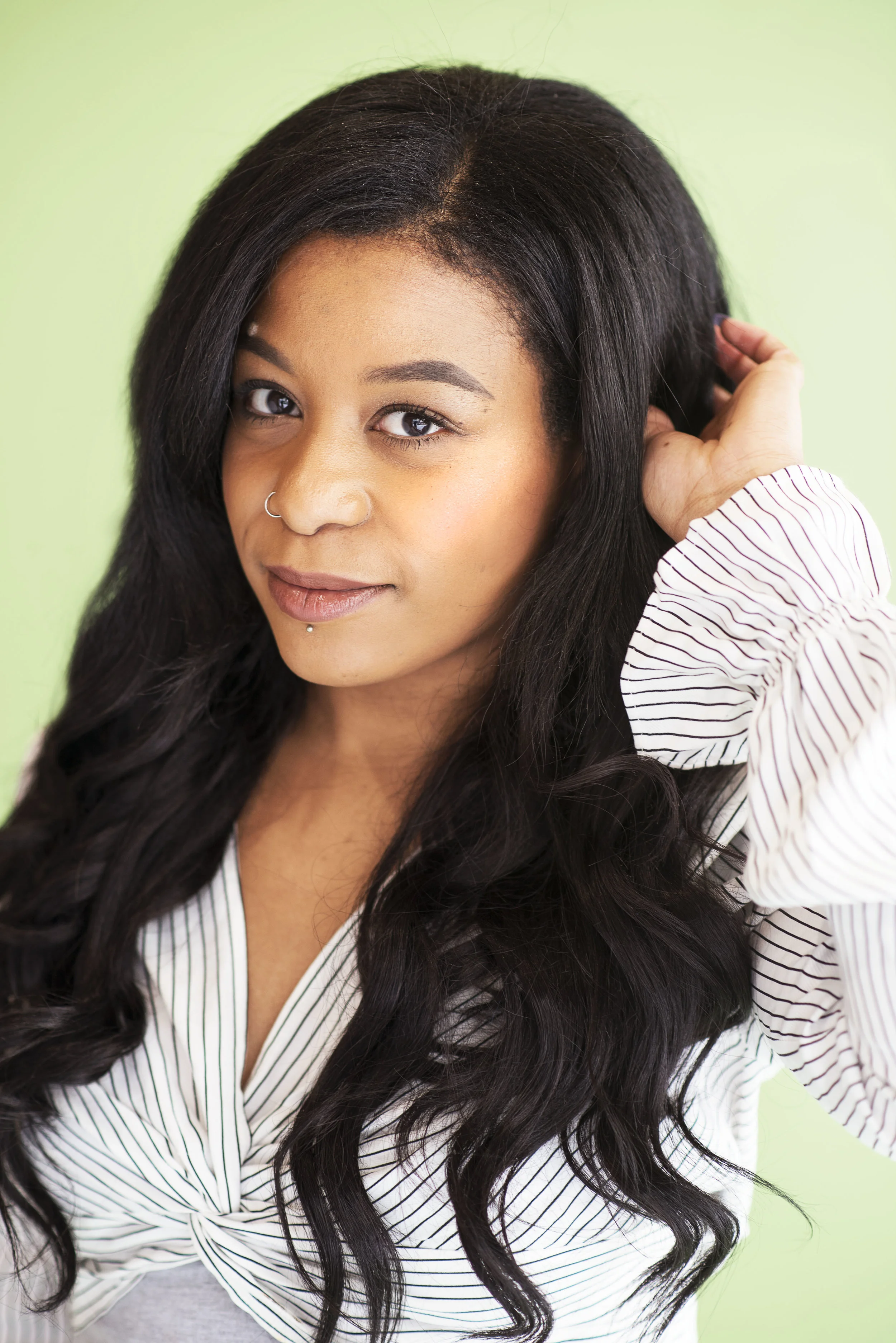 Hotel Arts Stylist Tivona modelling her Bellami clip-in extensions.