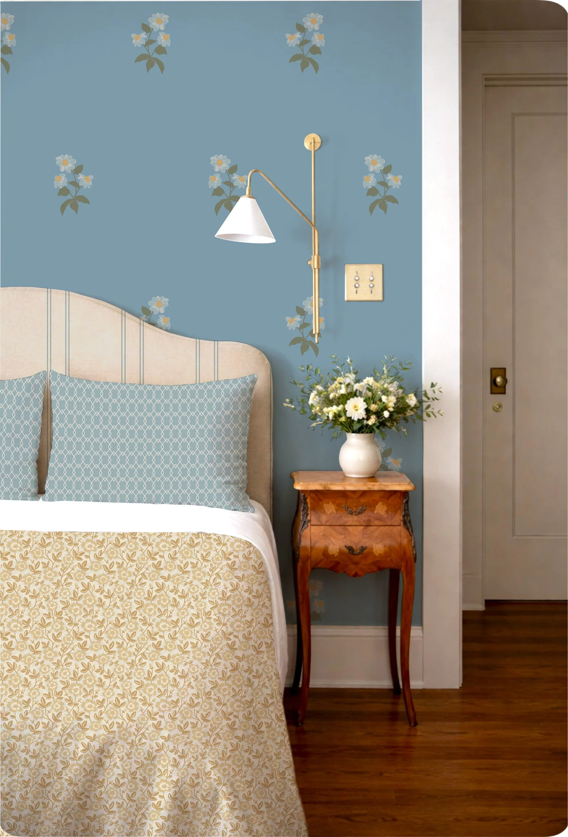 soft blue floral wallpaper in a warm cottage-style bedroom with upholstered headboard