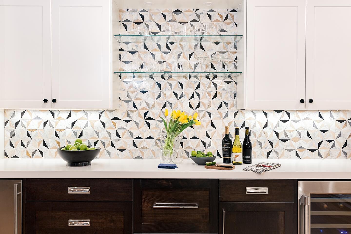 Monday....highlighting a magnificent marble mosaic. I love this backsplash! I&rsquo;ll take a bar like this any day of the week. A wine fridge, an ice maker, 2 refrigerator drawers and plenty of storage for glasses and cocktail accessories. Design: @