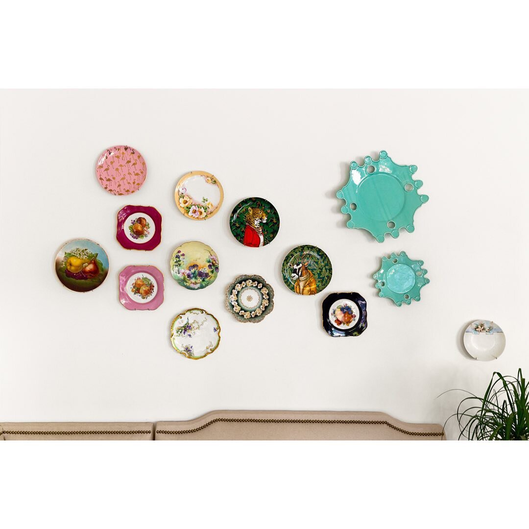 Whimsical wall Wednesday. Can&rsquo;t afford art? Need a space that offers a break from art on every wall? Hang your favorite plates. Some of these were painted by my great grandmother! Arrange them more traditionally in a symmetrical pattern using a