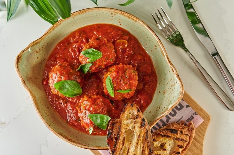 Meatballs in a spicy tomato sauce with chilli and basil and served with toasted ciabatta.jpg