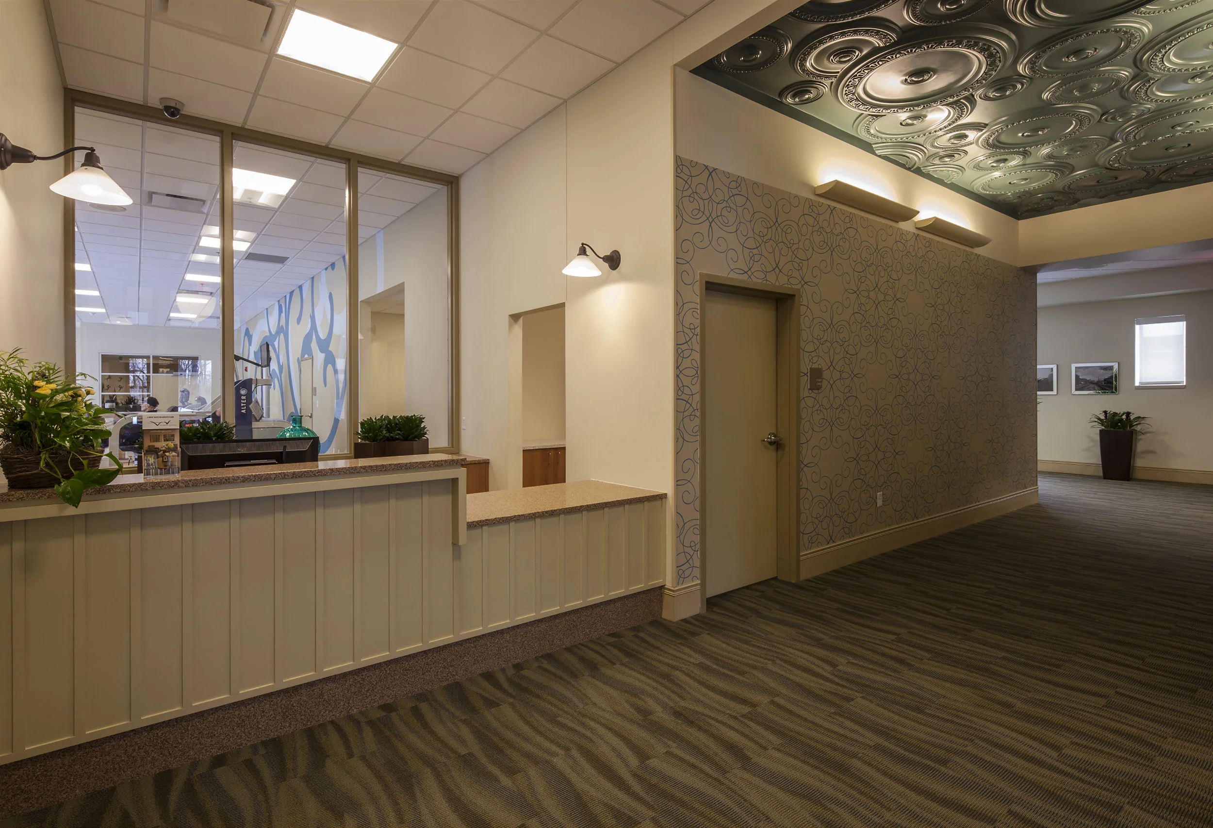 Reception desk with therapy suite beyond.