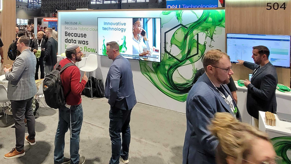 Nasuni booth at Microsoft Ignite 2024 with the Liquid Flow brand graphics