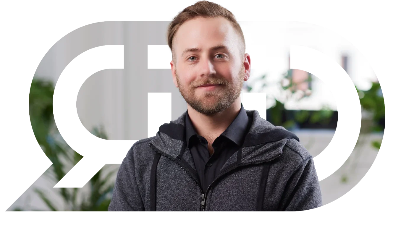 Ryan Thorp, graphic designer and creative strategist, framed by the RTD logo