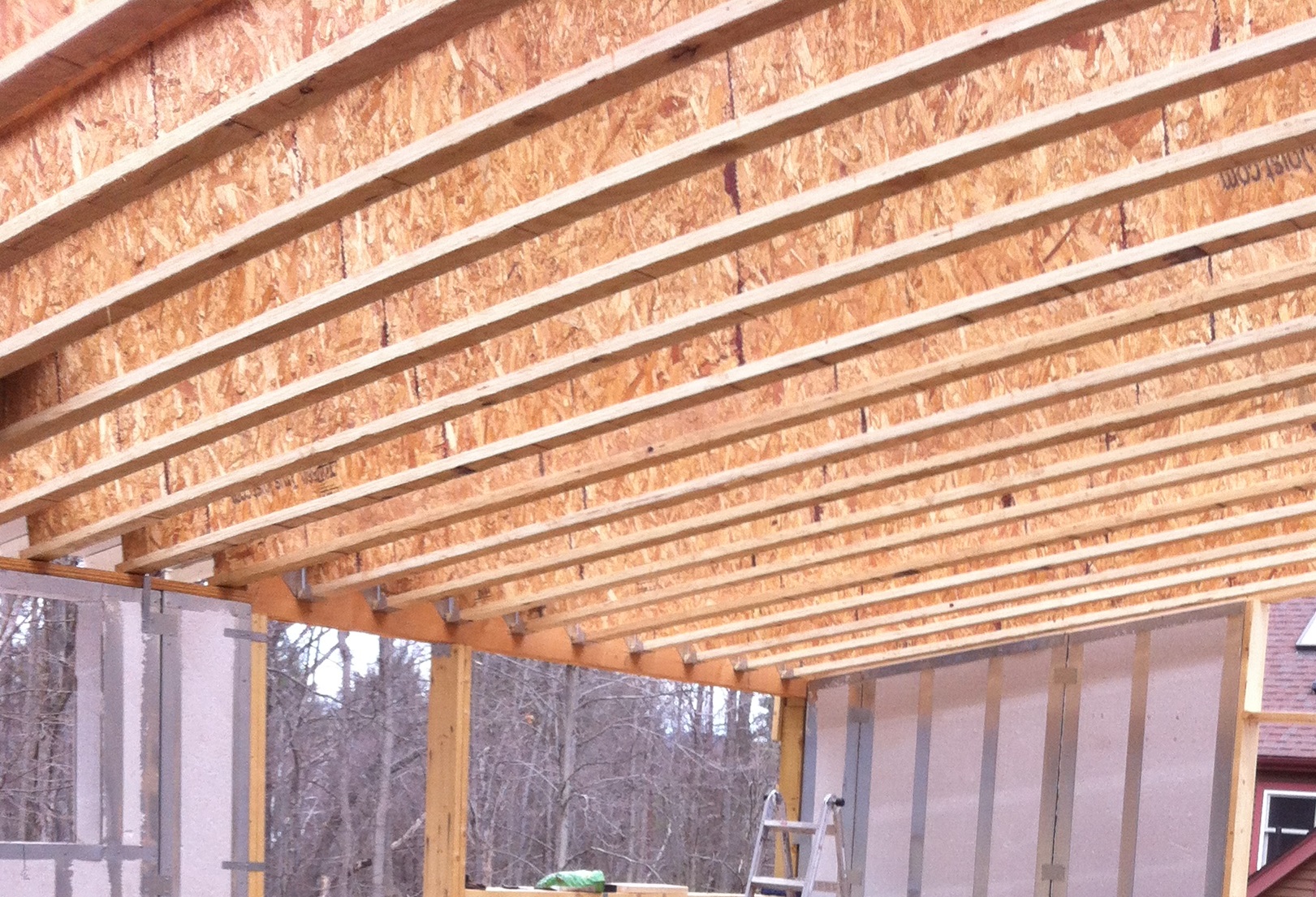 Manufactured I-joist rafters: dimensionally stable and strong, uses waste wood material, extensive processing with glues, extensive transportation energy used