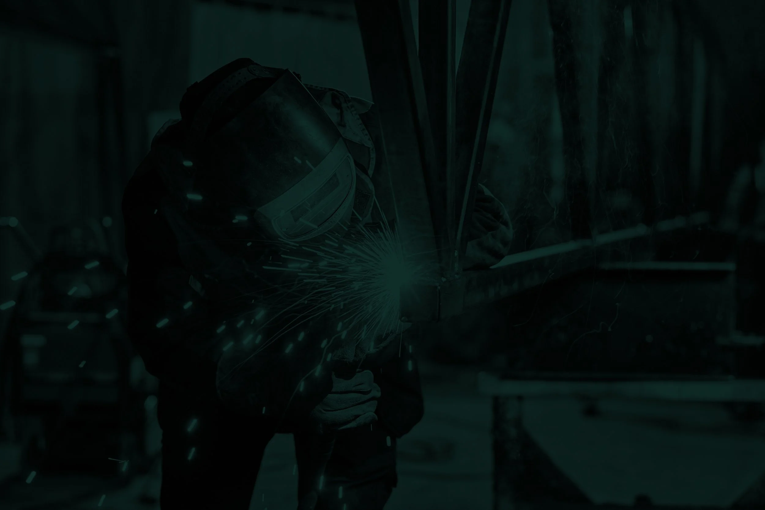 man-is-working-metal-factory-he-is-welding-piece-rail-using-special-tools.jpg