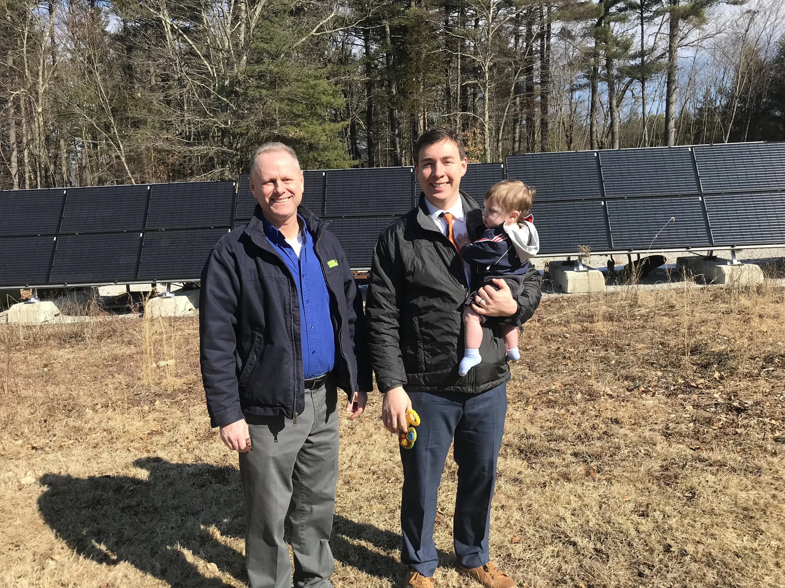 Mike Kelly and Senator Ryan Fattman with son Grant at Mass Renewable’s residential ground-mount install in Mendon.