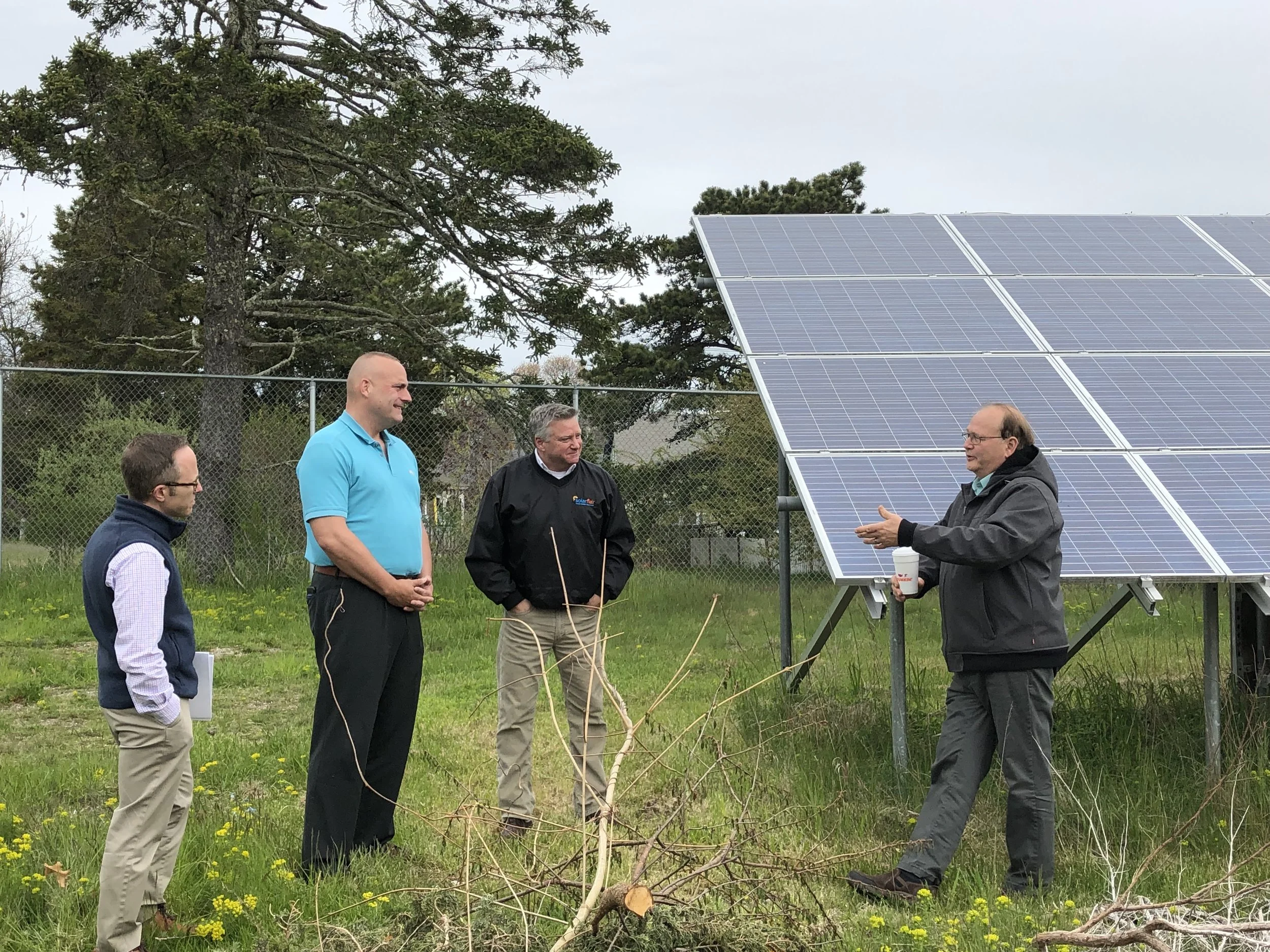 Mark Sylvia, Representative Whelan, and members from Solar Flair at Ray Hebert’s installation.