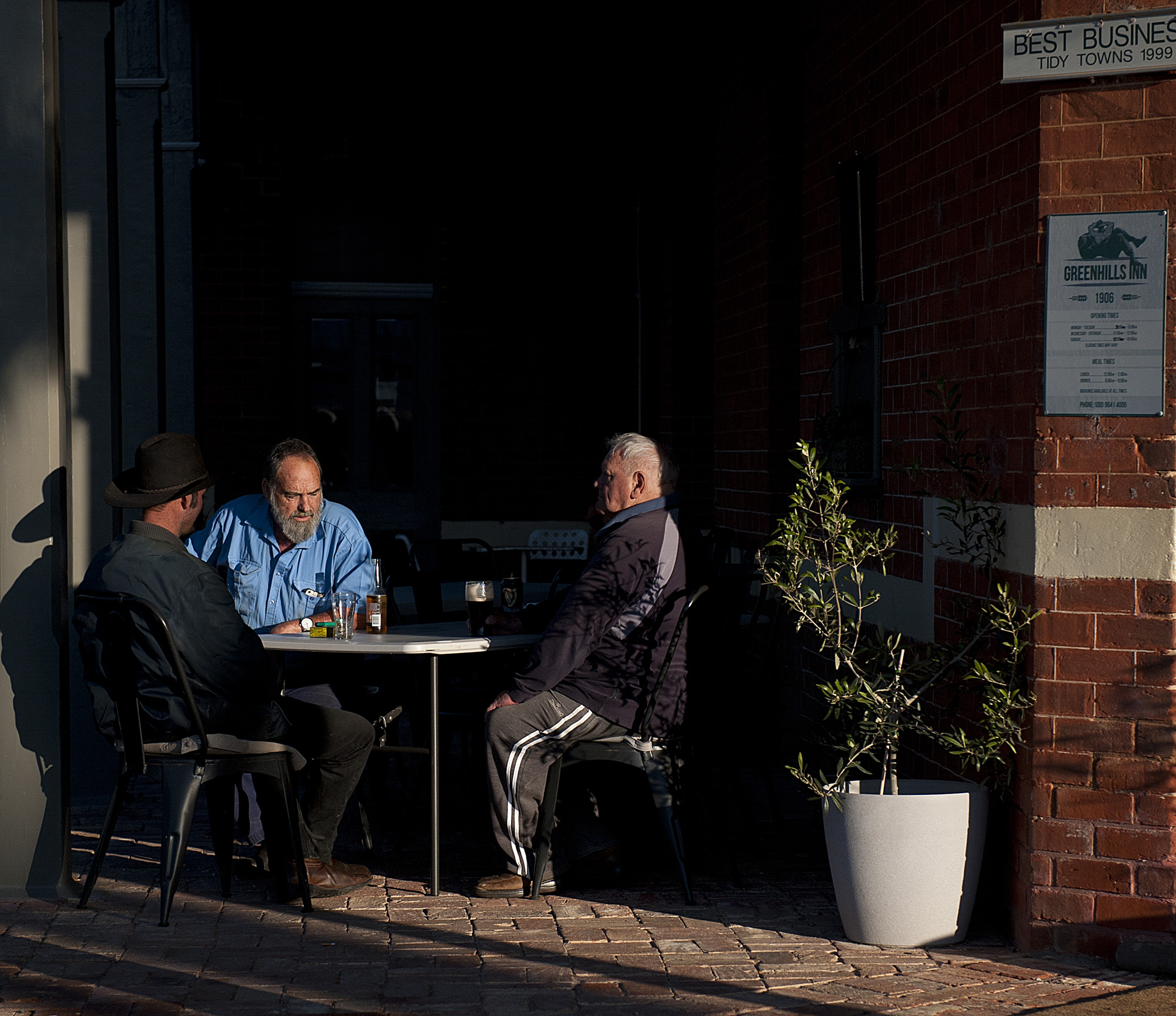 locals having a beer near the front door outside.jpg