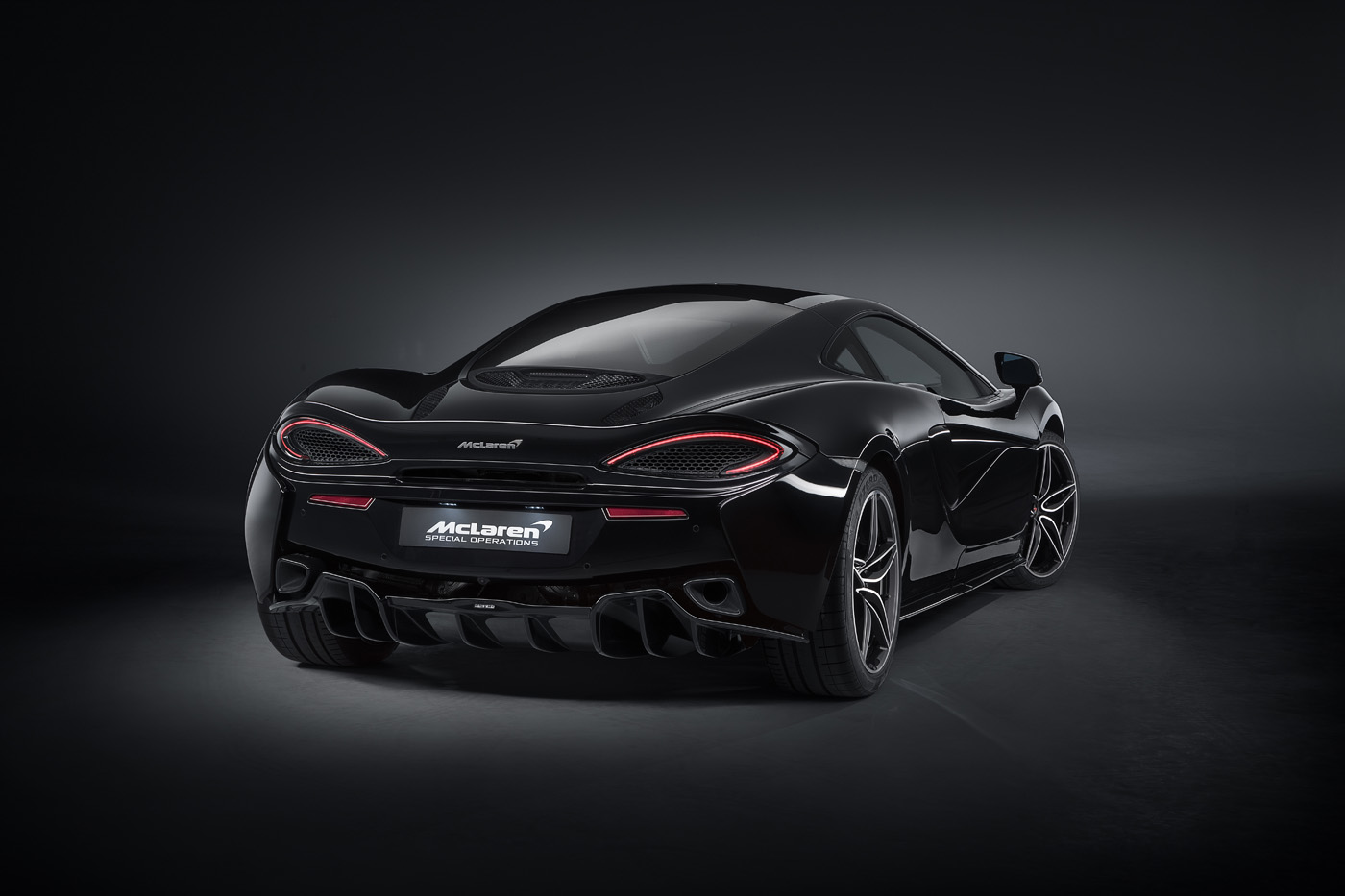 MSO Black 570GT Geneva_Rear_3Q_Boot_Down_V2.jpg