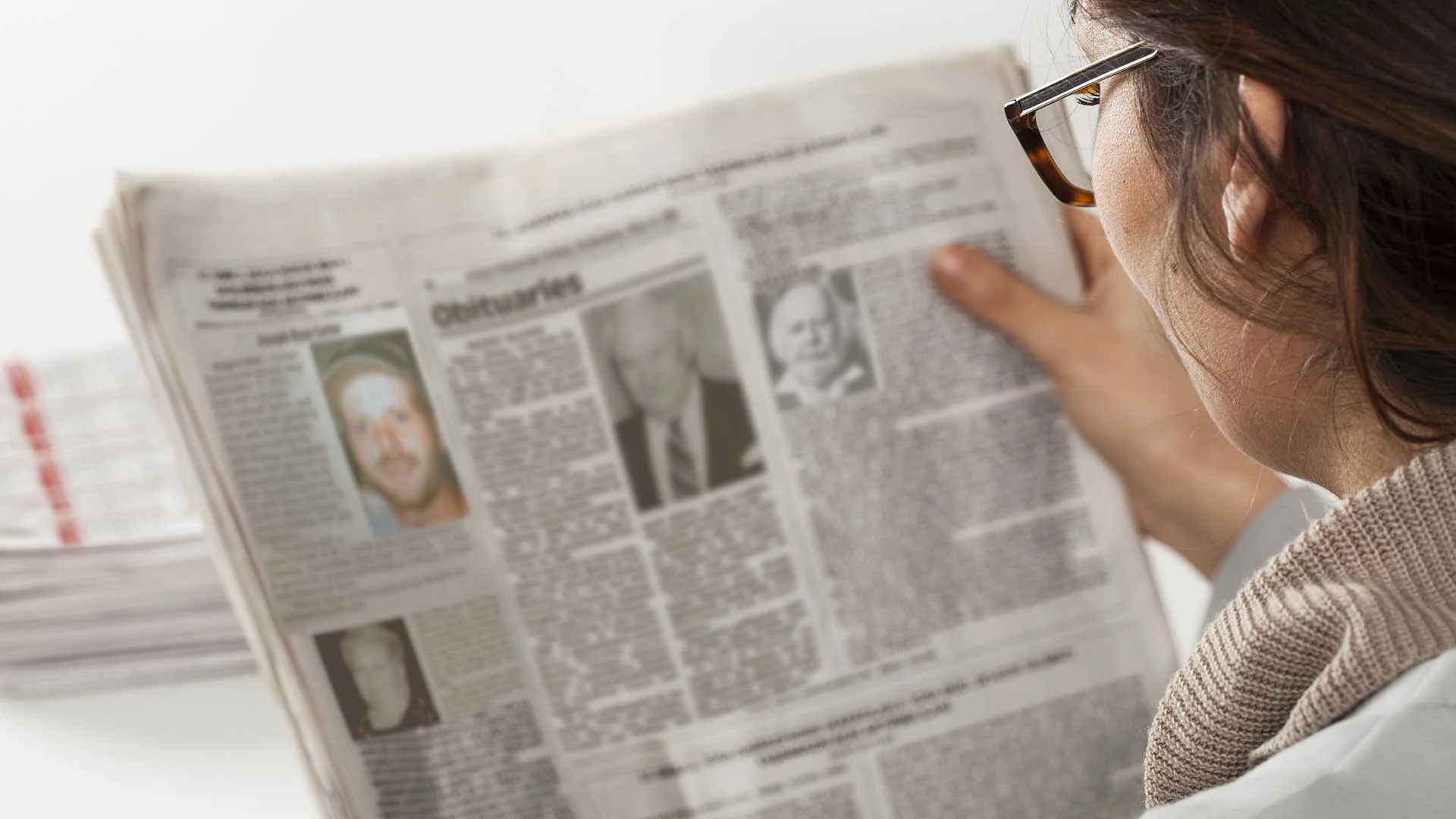 MN-Mom-Reads-Paper-Only-for-Obituaries.jpg