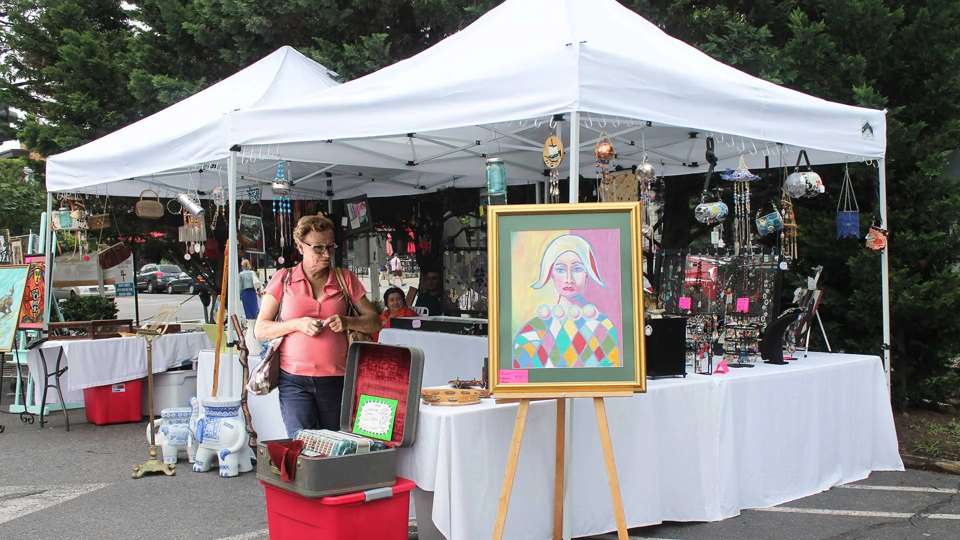 Uptown-Art-Festival-Attendee-Makes-a-Beeline-for-the-Wind-Chimes.jpg