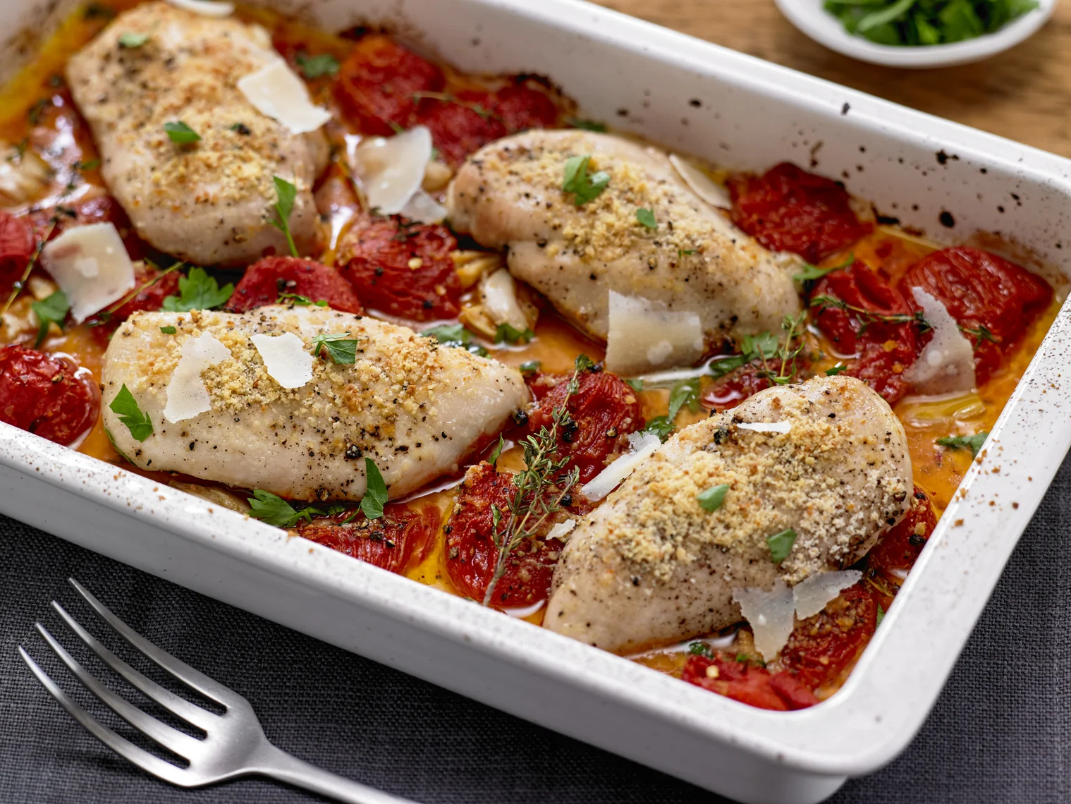 Alison Roman's Baked Chicken with Crispy Parmesan and Tomatoes; photo by Michael Kraus for The New York Times
