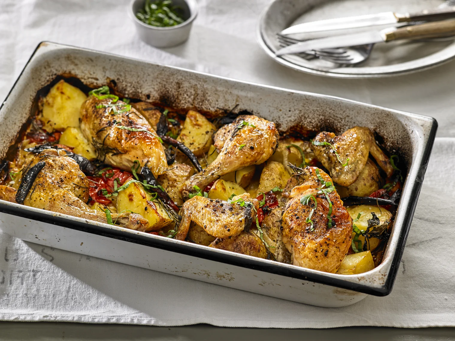 Julia Moskin's Chicken Baked with Potatoes, Cherry Tomatoes and Herbs; photo by Michael Kraus for The New York Times