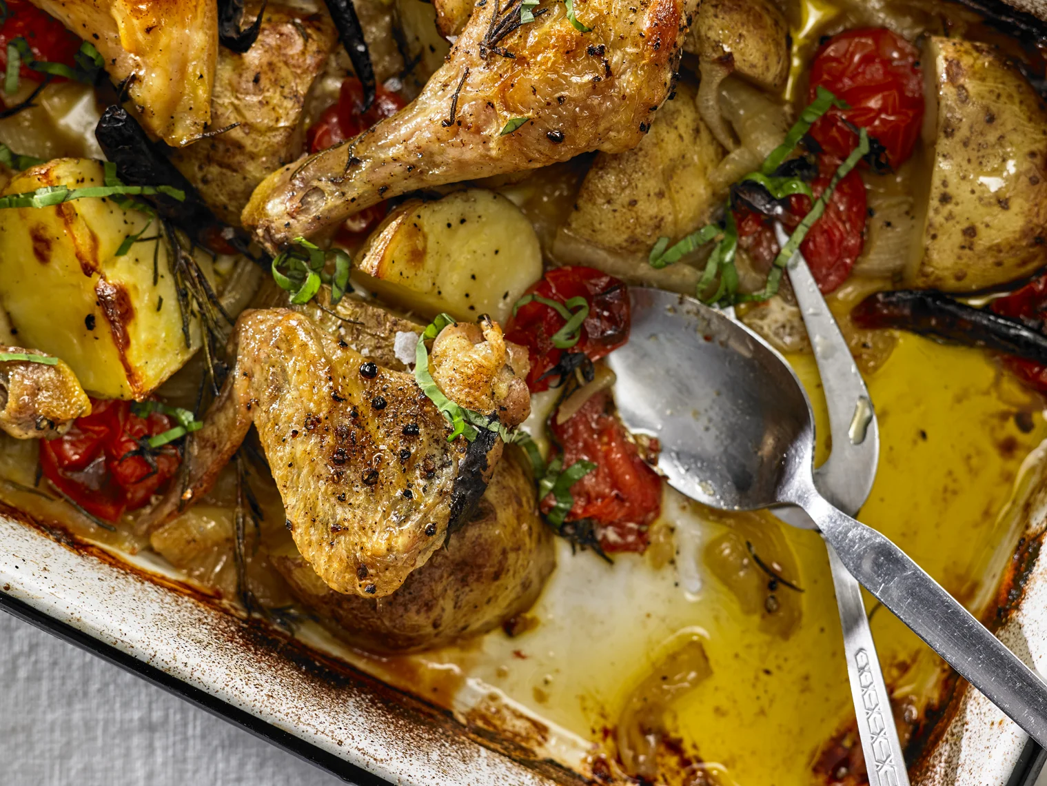 Julia Moskin's Chicken Baked with Potatoes, Cherry Tomatoes and Herbs; photo by Michael Kraus for The New York Times