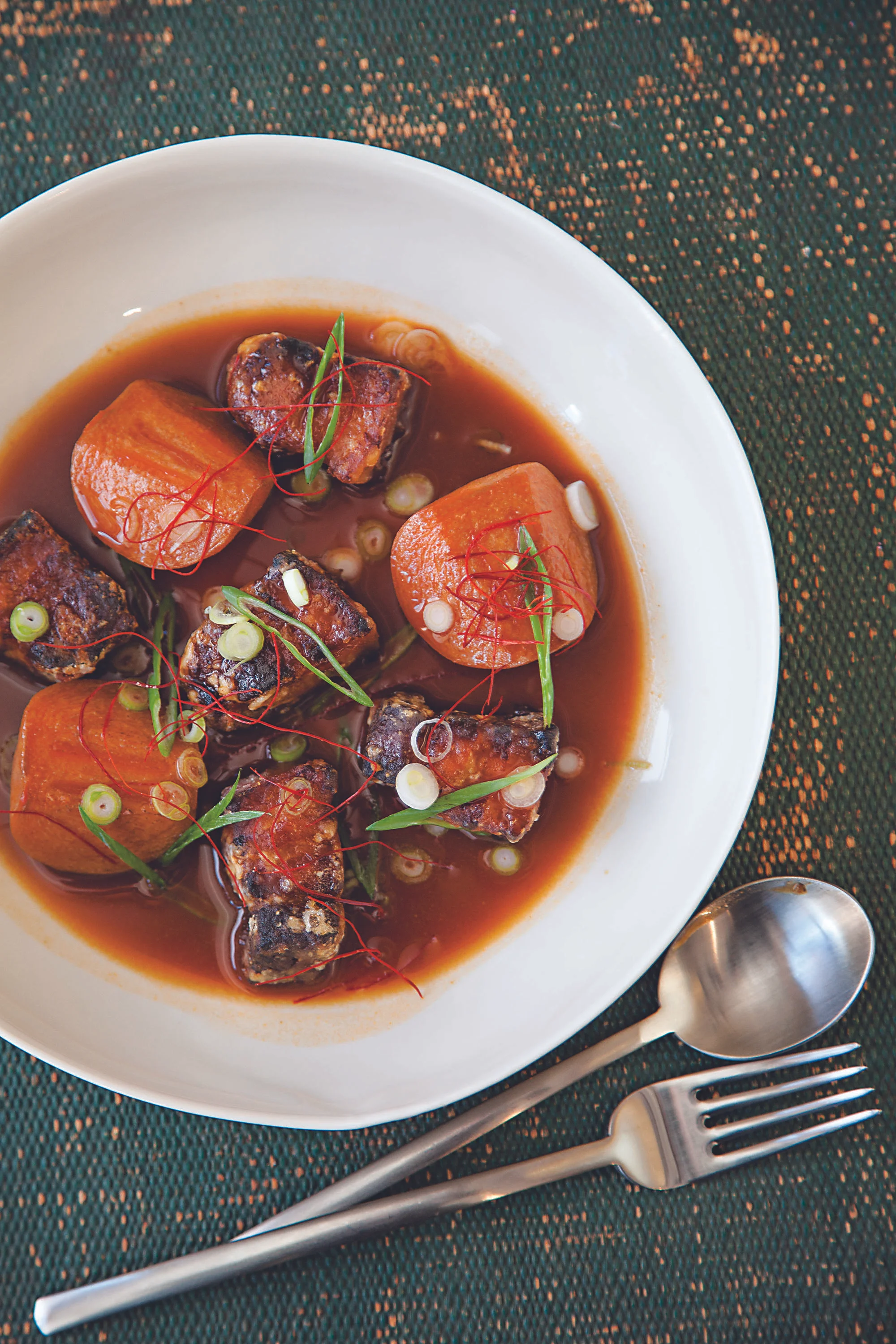 Crispy Pork Belly with Persimmons; photo by André Baranowski for SAVEUR