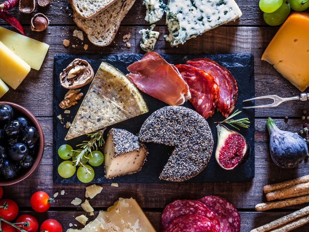 How to Make an Irresistible Cheese Board for Any Holiday Party (Getty Images for Men's Health)