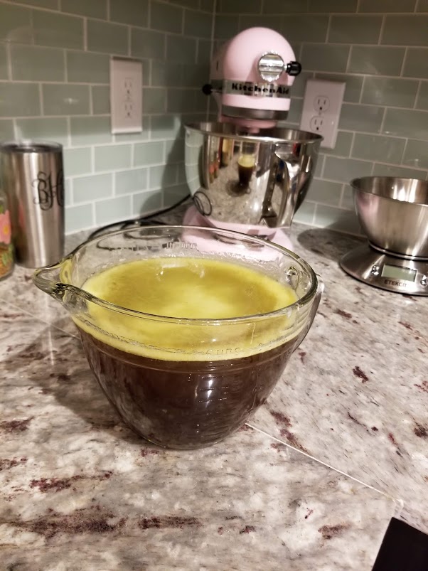 The yellow layer of fat is what you want to let settle - and then remove from your broth.