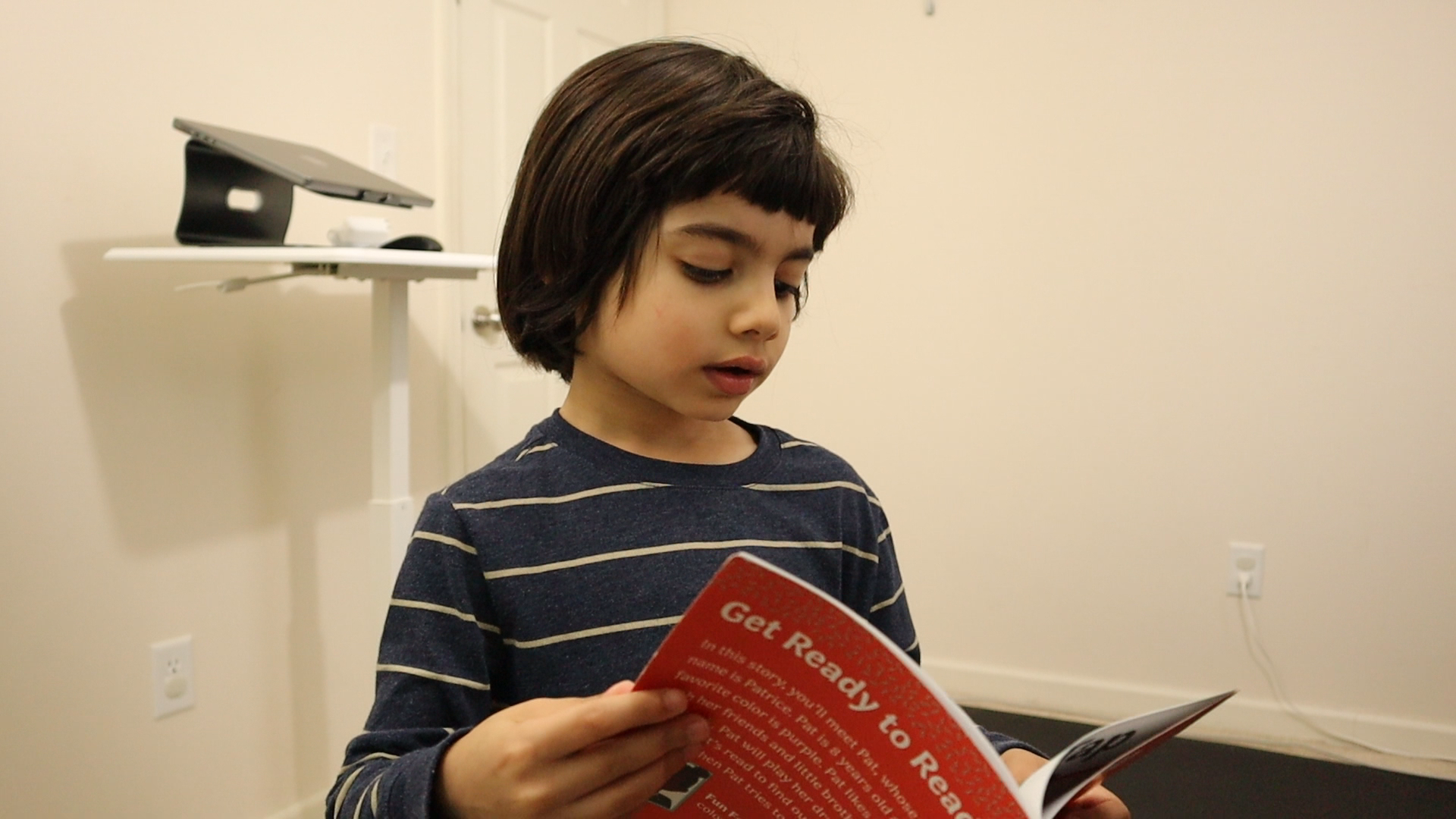 preschool boy reading toddlers can read decodable book.PNG
