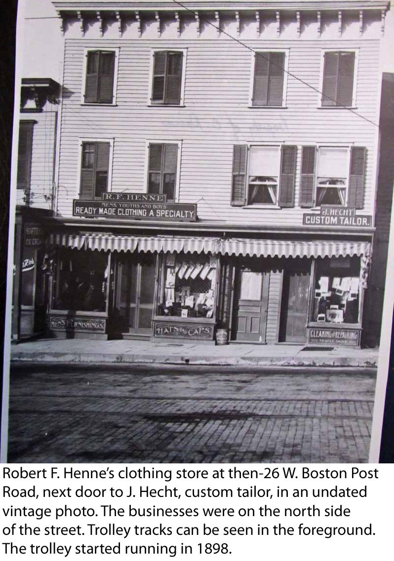  Robert F. Henne’s clothing store at 26 West Boston Post Road in Mamaroneck, next door to J. Hecht, custom tailor, in an undated vintage photo. The businesses were on the north side of the street. Trolley tracks can be seen in the foreground. The tro