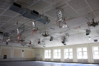  The space at Mamaroneck High School after removal of James Fenimore Cooper-themed murals for preservation and relocation. 