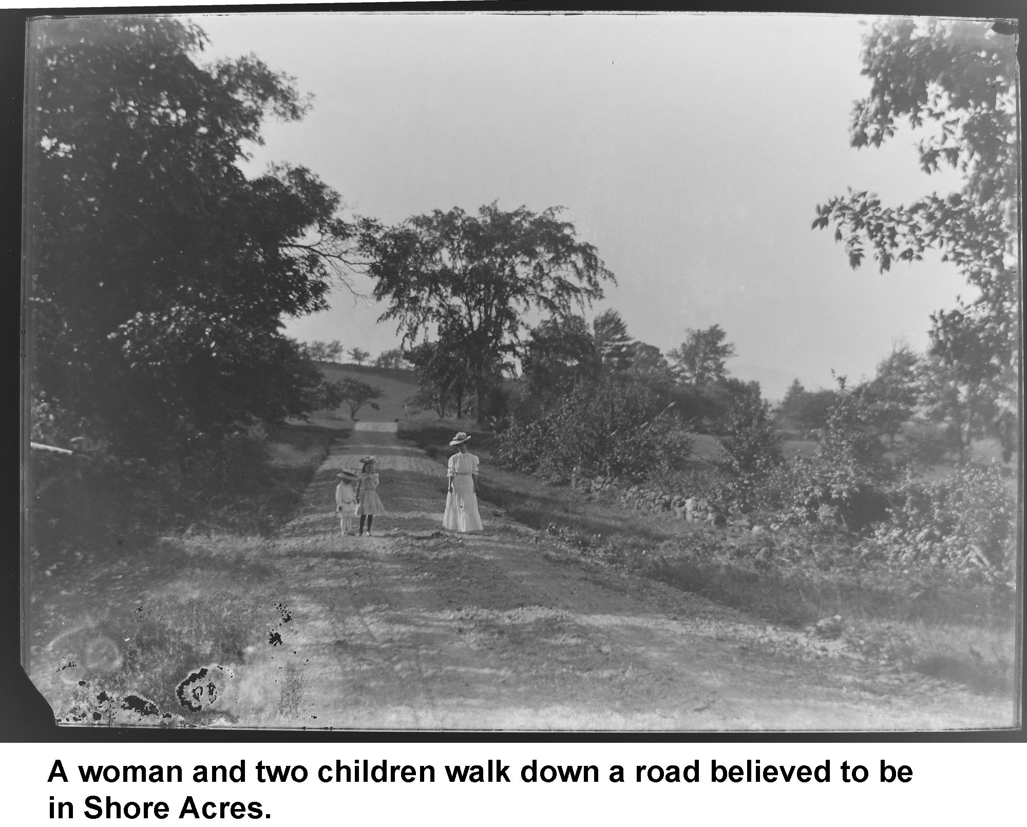 GN-036-new Woman and two children walking in Shore Acres.jpg