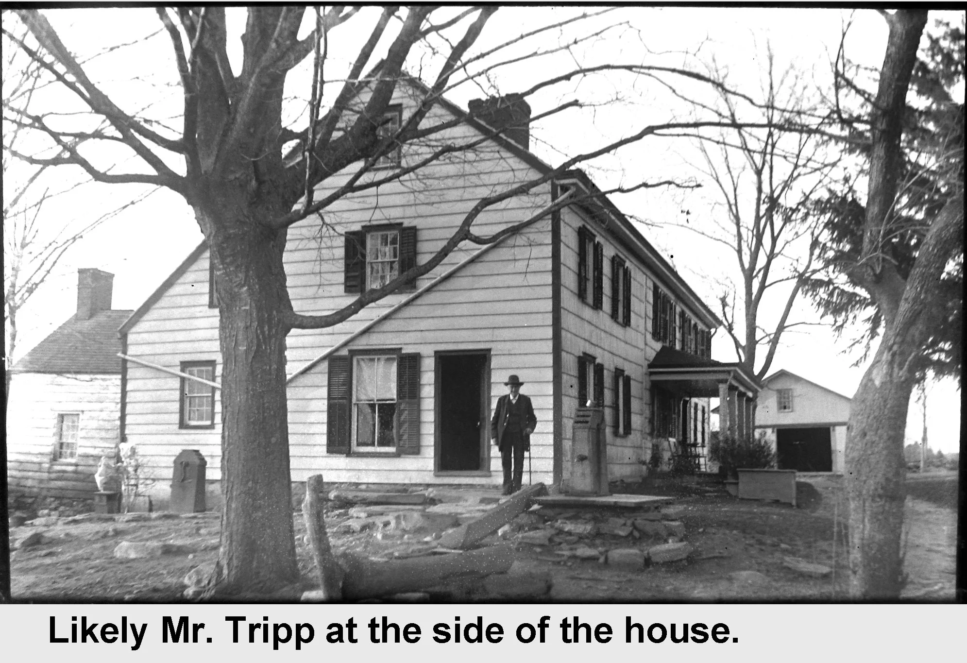Likely Mr. Tripp at the side of the house - vintage photograph