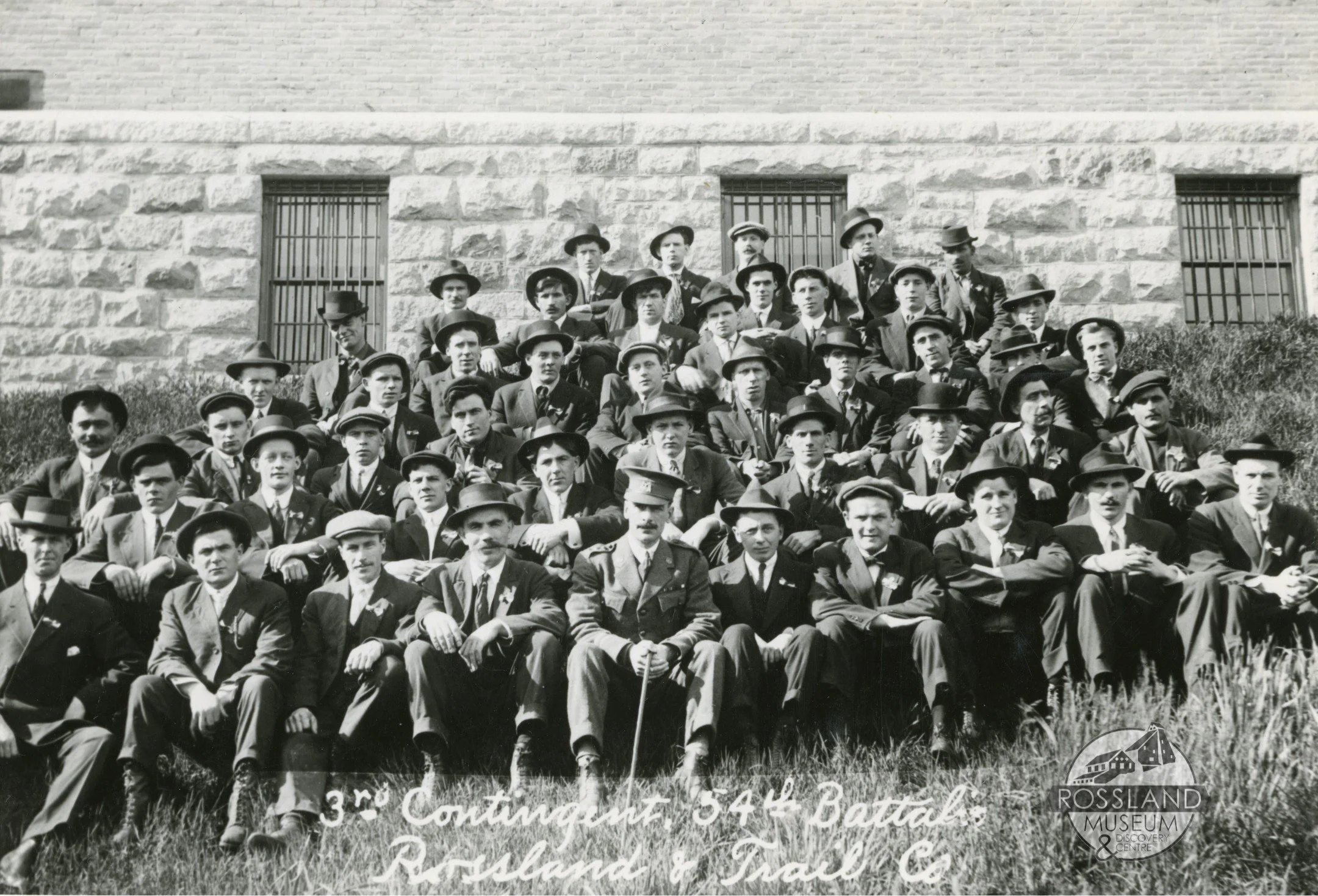  2357.0086: Third Contingent 54th Battalion Rossland-Trail Co, taken at side of the Armouries, Rossland, circa 1916 