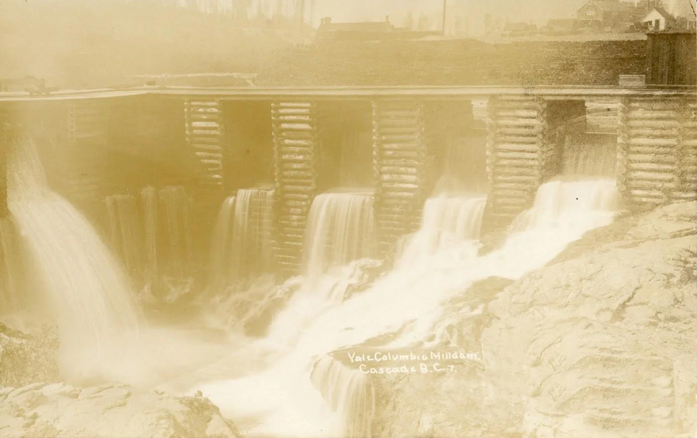 Photo 2318.0022: The Cascade Power House on the Kettle River. This photo was taken in 1920 when the dam was being operated by WKPL.