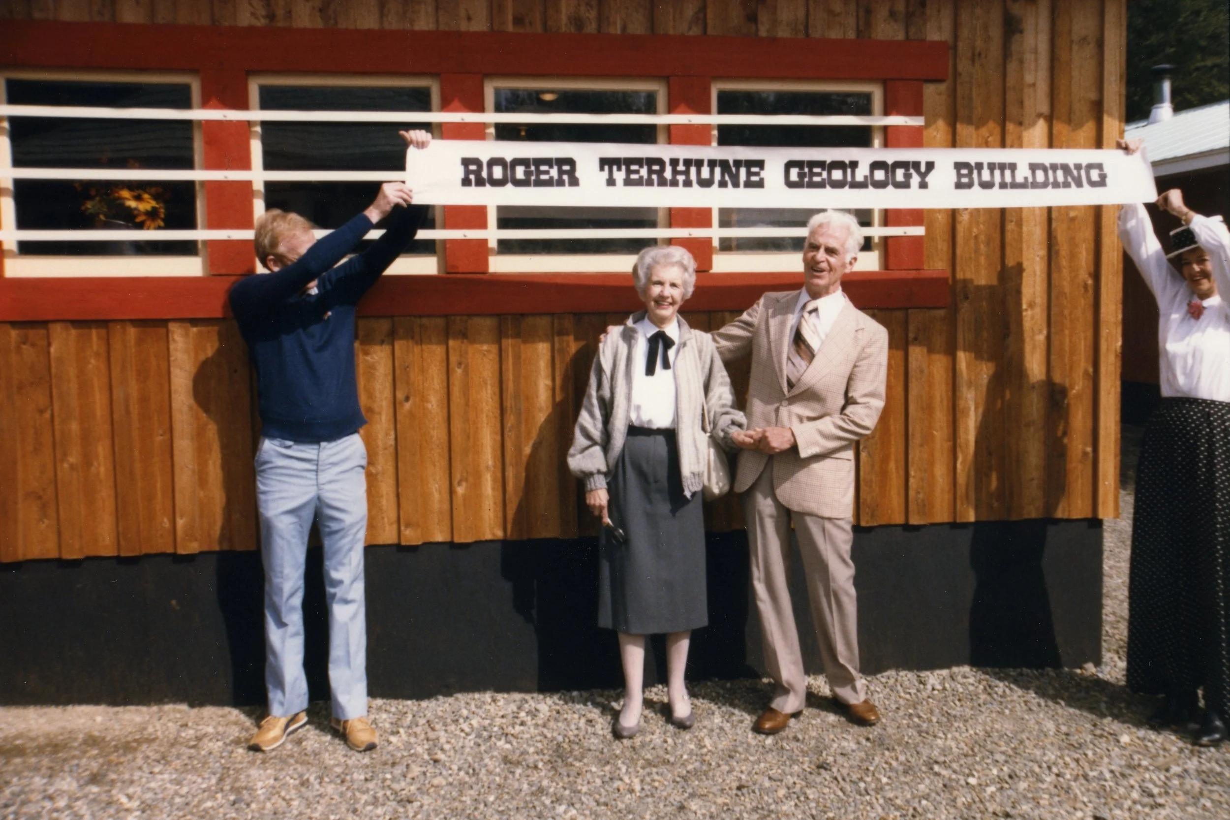 Photo 2349.0096: The opening of the Roger Terhune Geology Building in September 1985 during Rossland’s Golden City Days celebrations. Pictured from left to right: Brian Fulsom, Mrs. Terhune, and Roger Terhune.