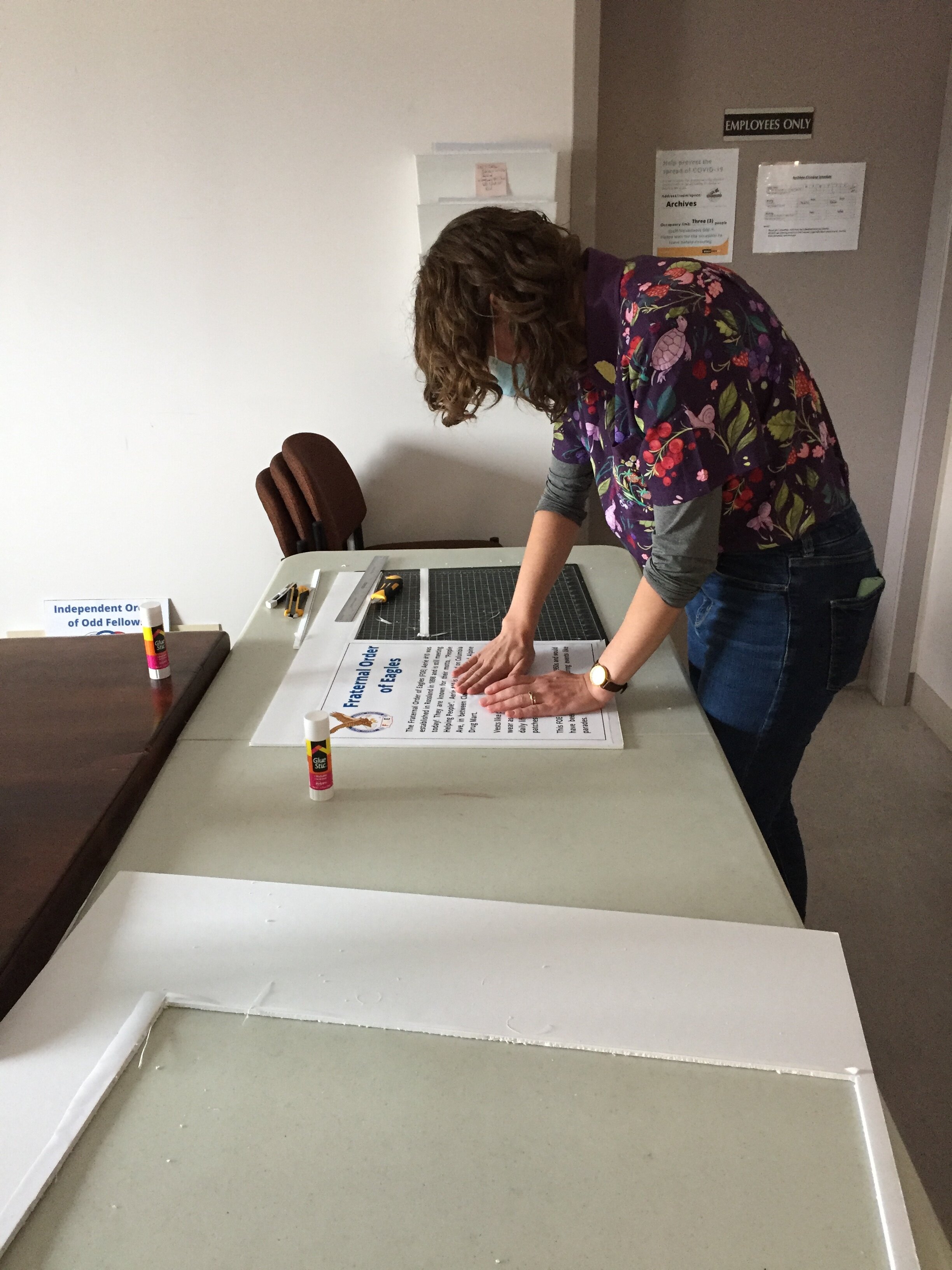 Collections Intern Phoebe prepping panels