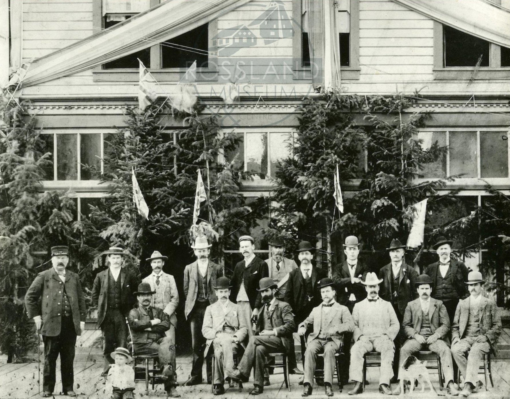   2297.0023 : Rossland Pioneers, 1898.  Left to Right: John Ingram, Chief of Police; T.H Long, Sanitary Inspector; S.W Forteath; William McQueen, City Clerk; W.H Falding, City Auditor; Ed Noise; G.A Jordon; Hart Mcharg; W.M Harp; Dr. Reddick; Sitting