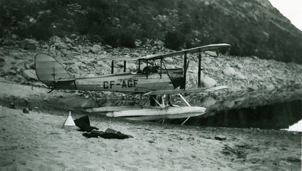  2320.0113: The D.H. Gipsy Moth floatplane owned by Jimmy Harper and Bill Purcello for the Harper-Purcello Training School.  Image taken in Trail’s Sunningdale neighbourhood, circa 1935. 