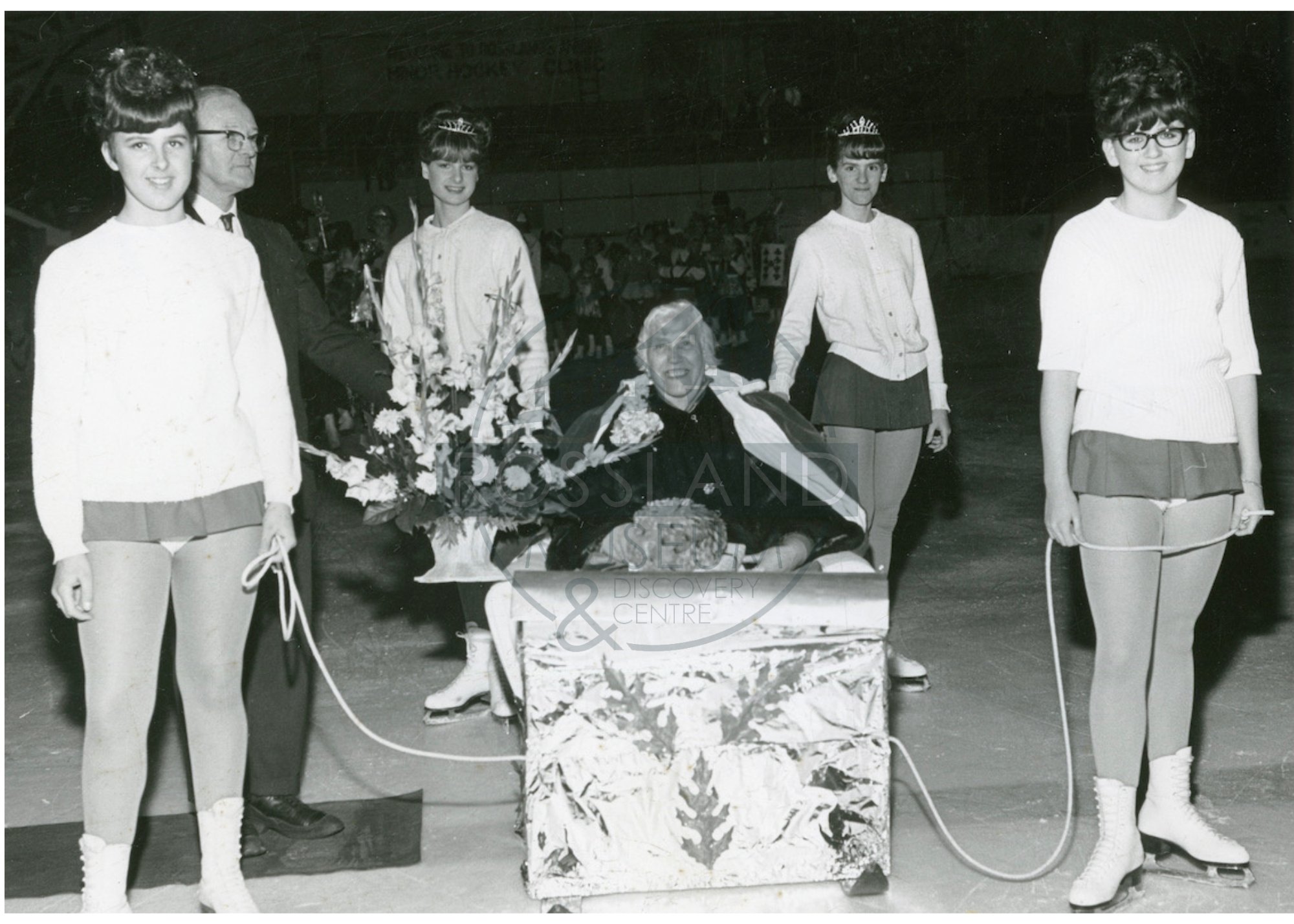  2369.0216: Snow Queen Erna Coombes at the Rossland Arena being crowned by Mayor Harry Lefevre, 1967. 
