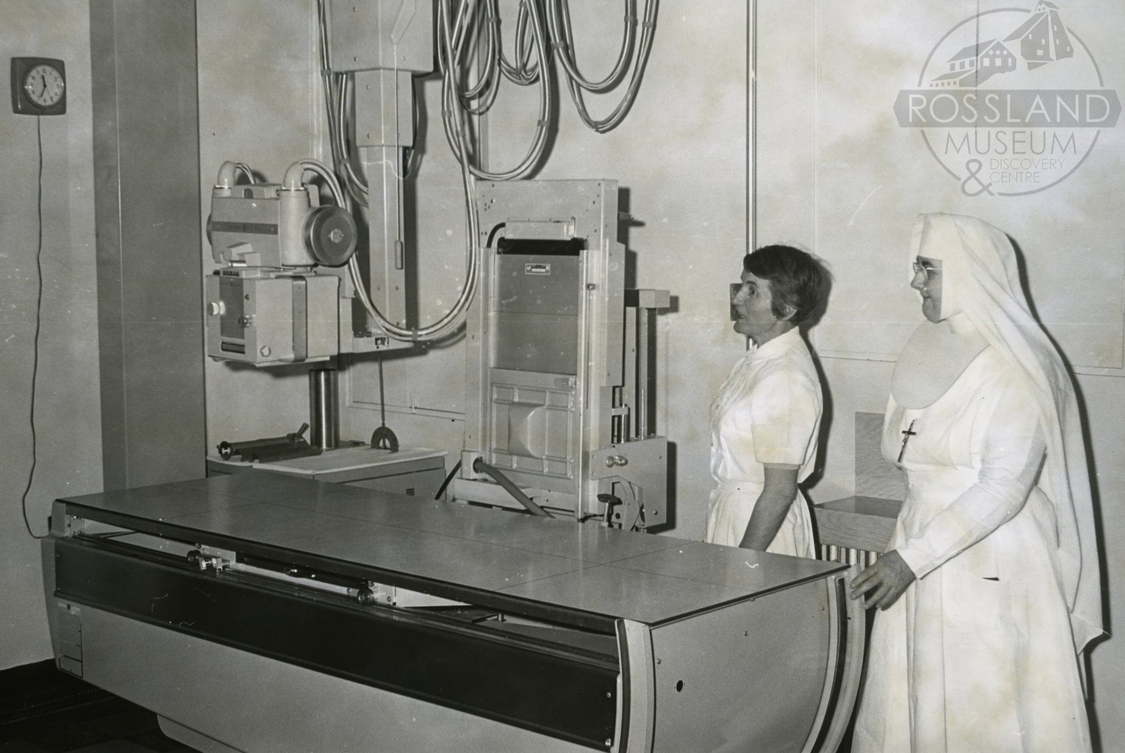   2276.0360  :  Sister Francis Joseph Superior of Mater Misericordiae Hospital &amp; Technician Rose Butz with a new $20,000.00 X-Ray Unit, January 9, 1964. The purchase of the equipment was made possible by a bequest from the late Lieutenant Governo