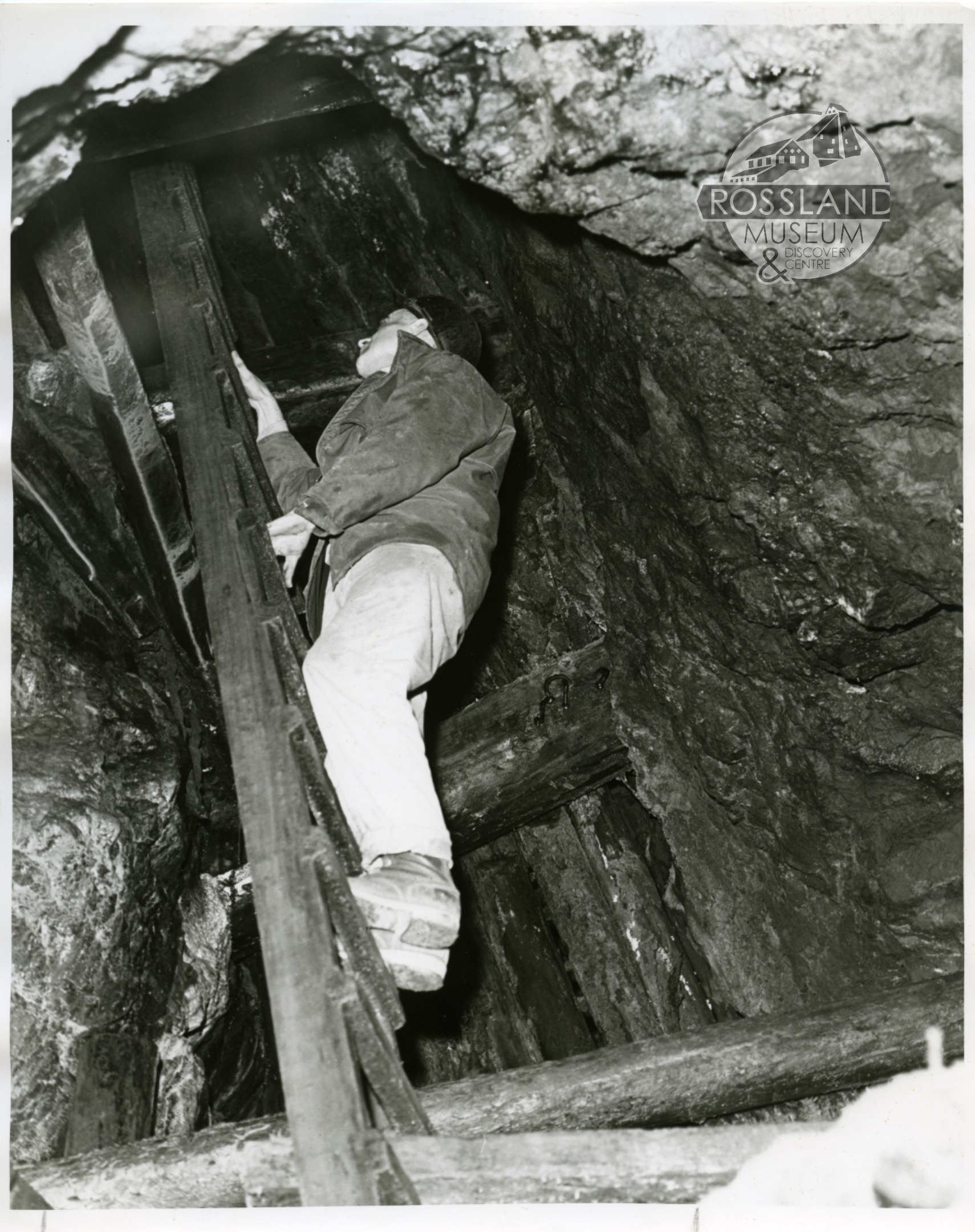 Photo 2276.0280: Roger Terhune looking up the manway in the LeRoi Mine, 1967