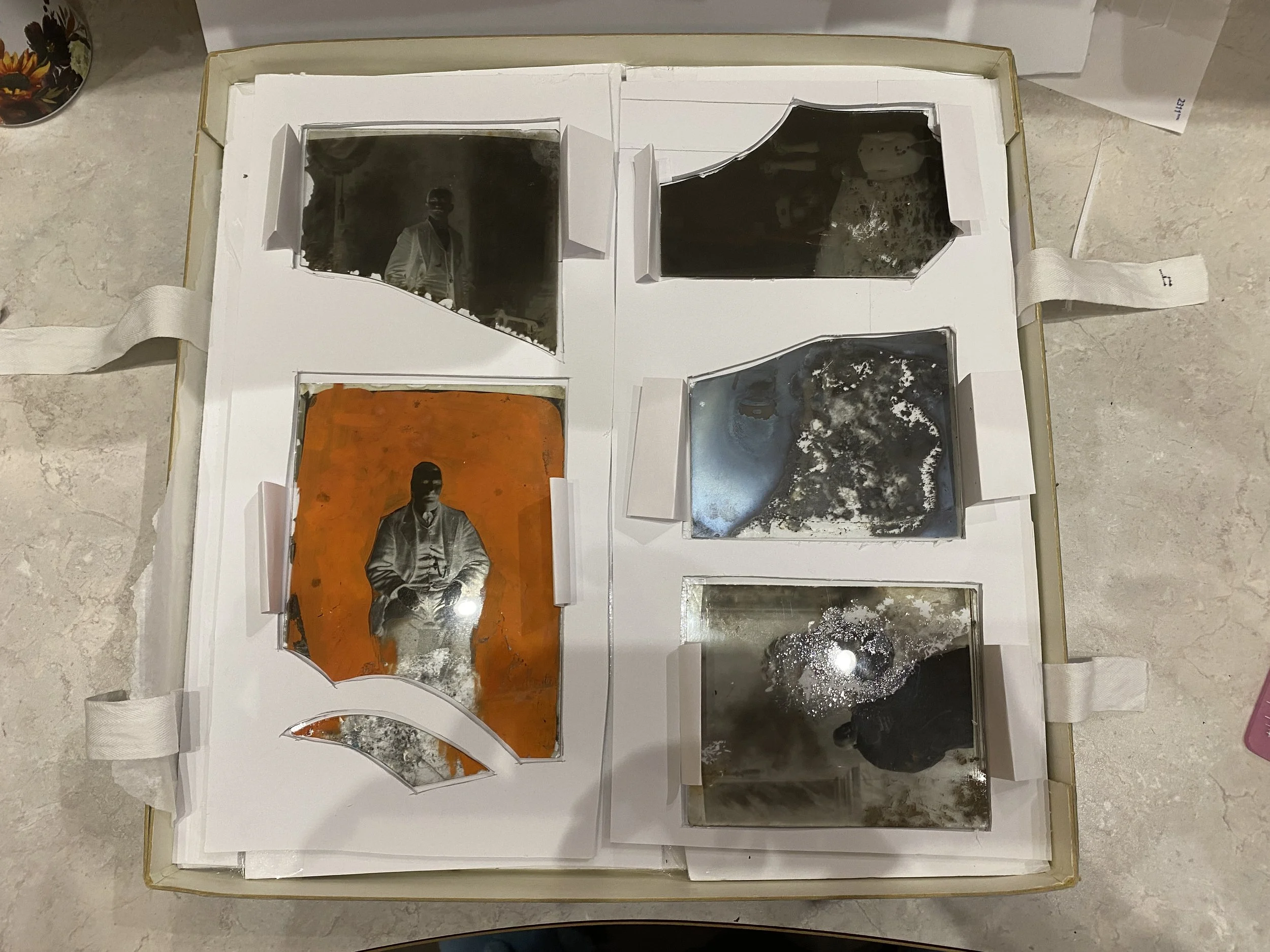 Fragile glass plate negatives in their sink mattes