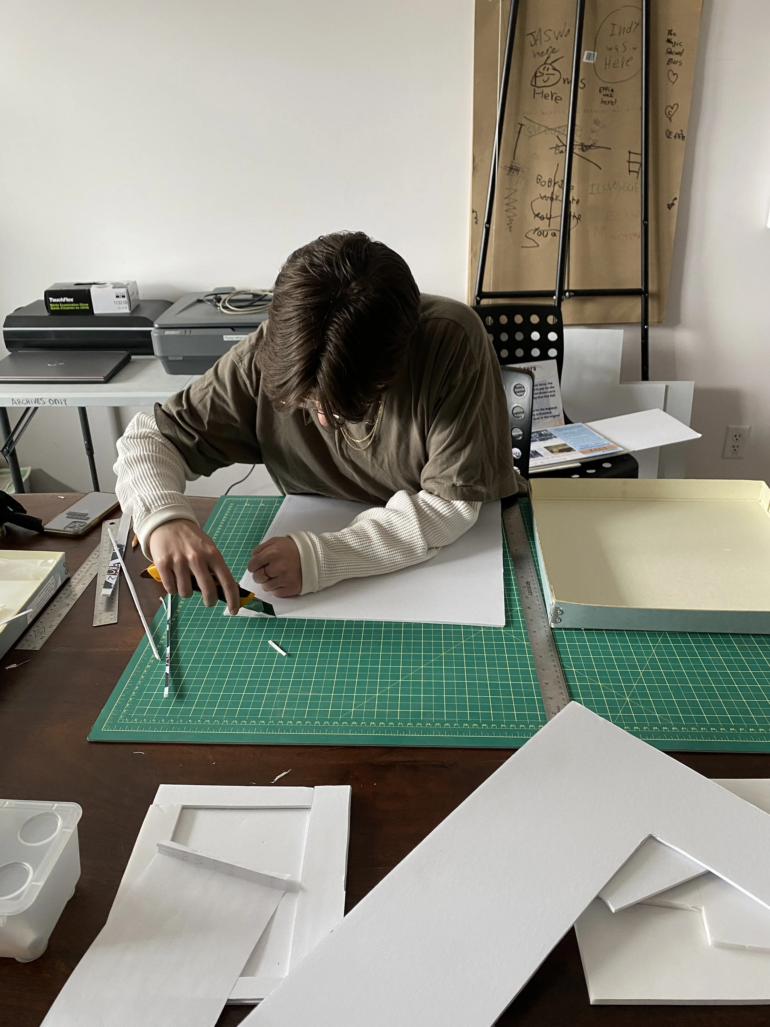 Archives Coordinator Gwen Friesen making a custom sink matte 