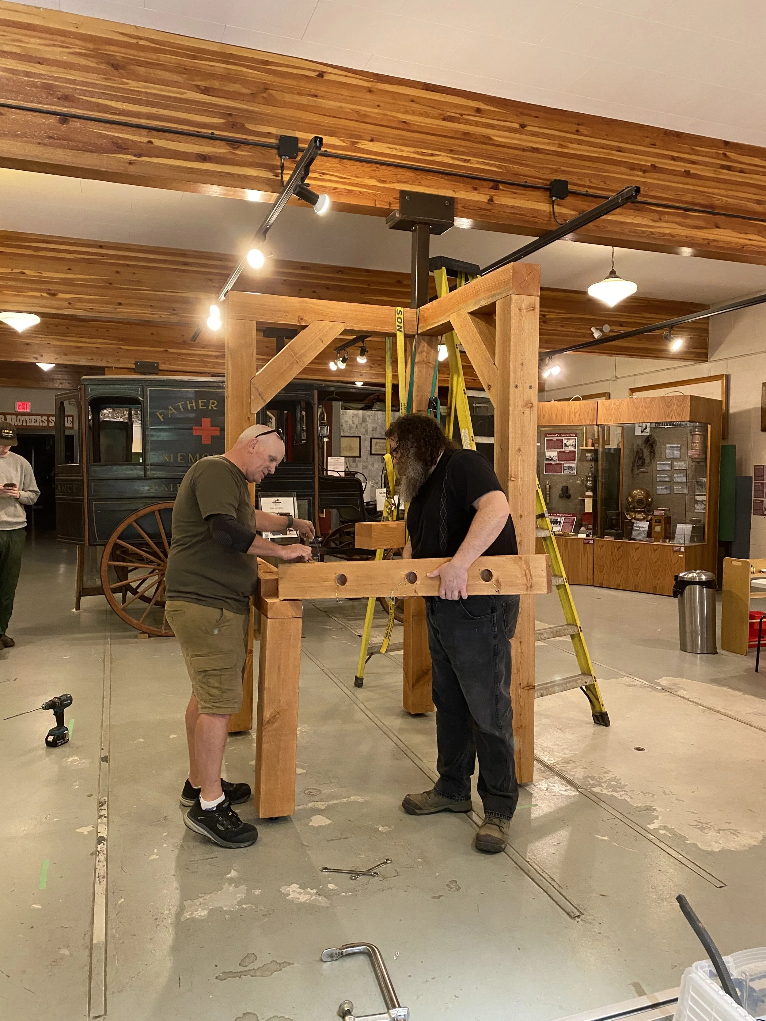 Members of the Selkirk Technology Access Centre building the frame