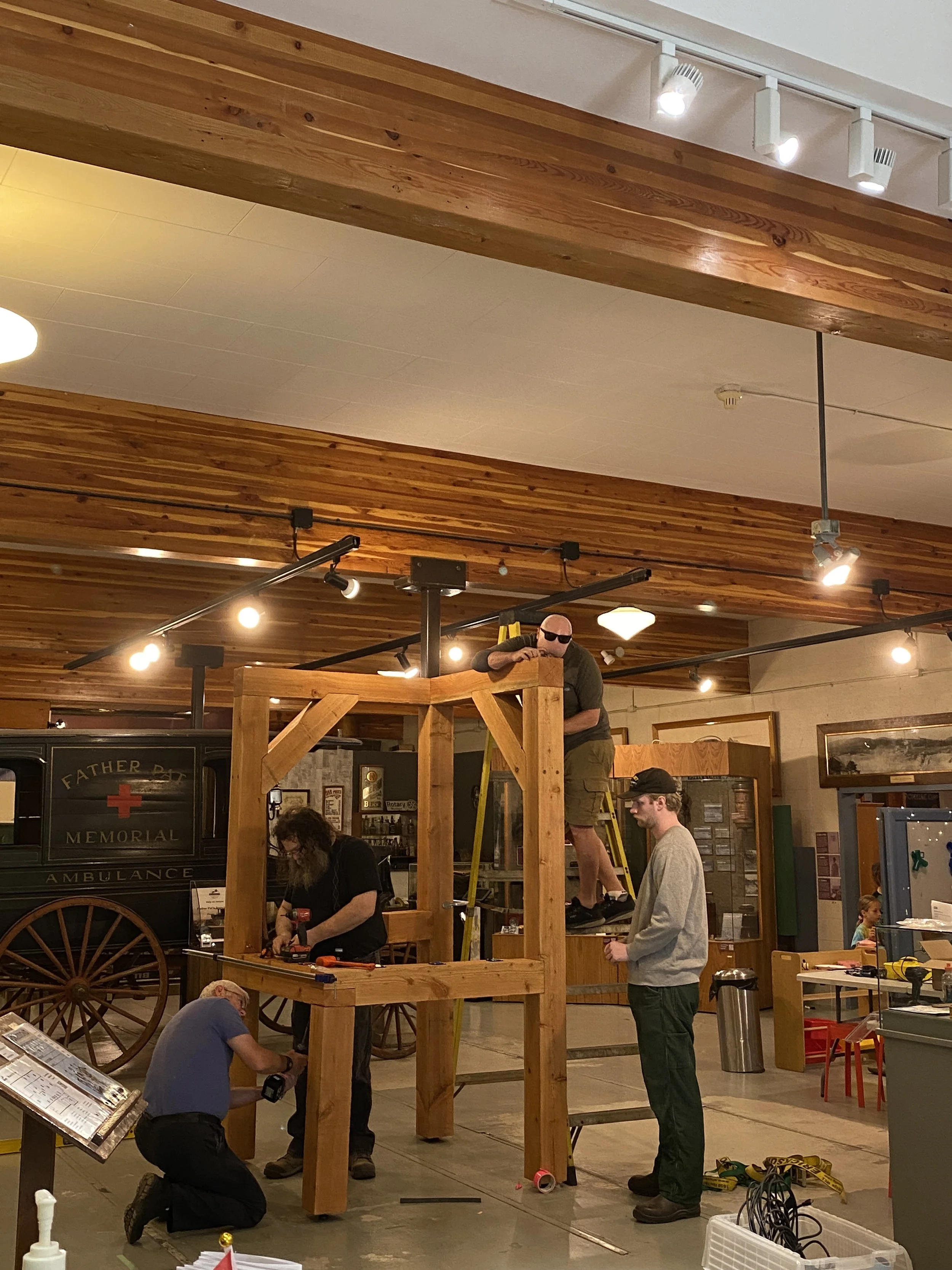 Members of the Selkirk Technology Access Centre building the frame