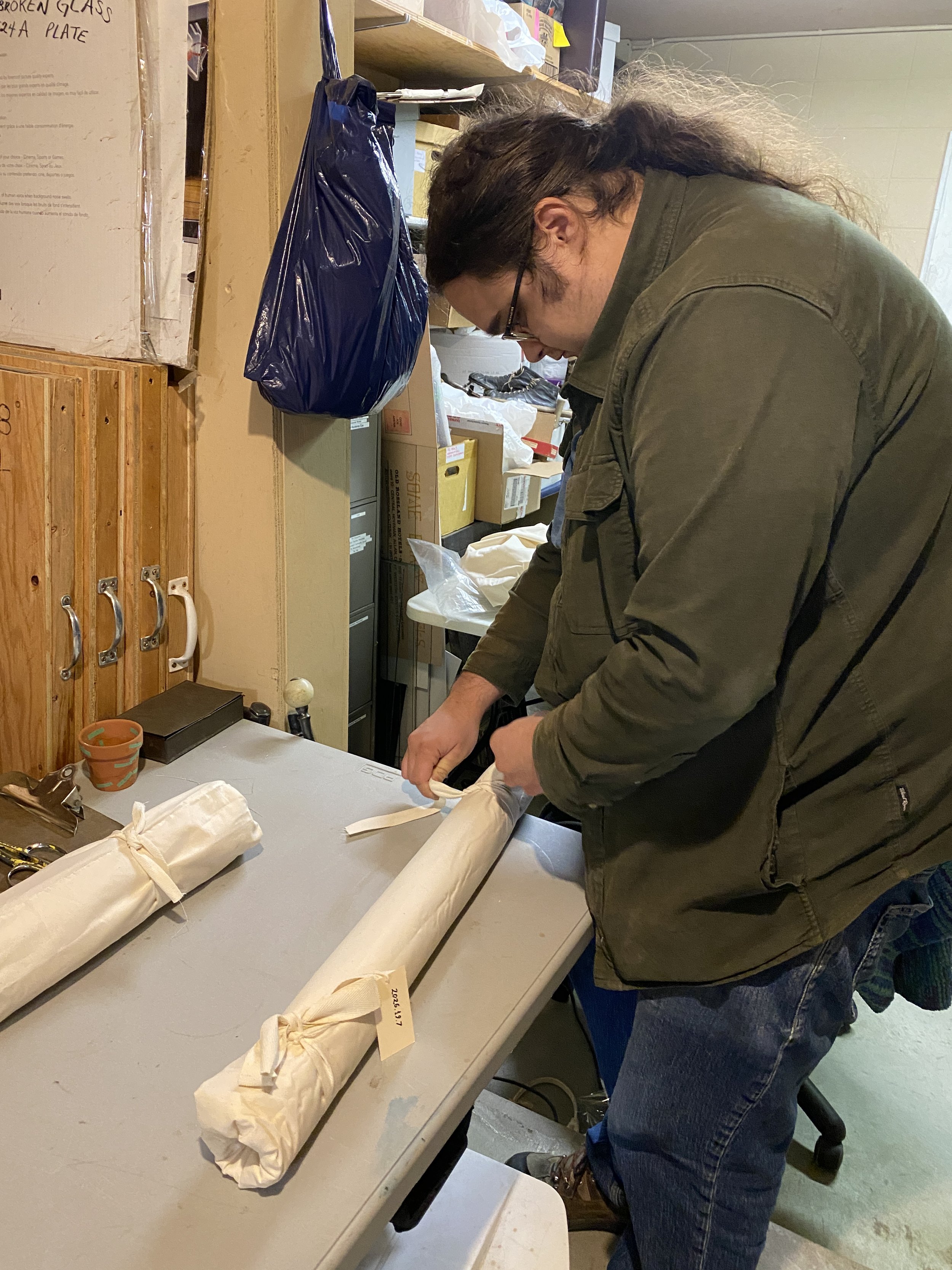 Putting a protective muslin wrap on the outside of the flags to keep the dust off, 2026