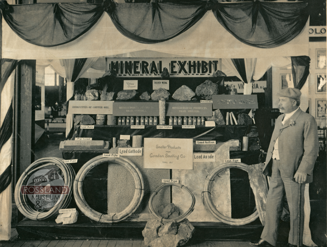 Black and white photograph of a mineral display booth