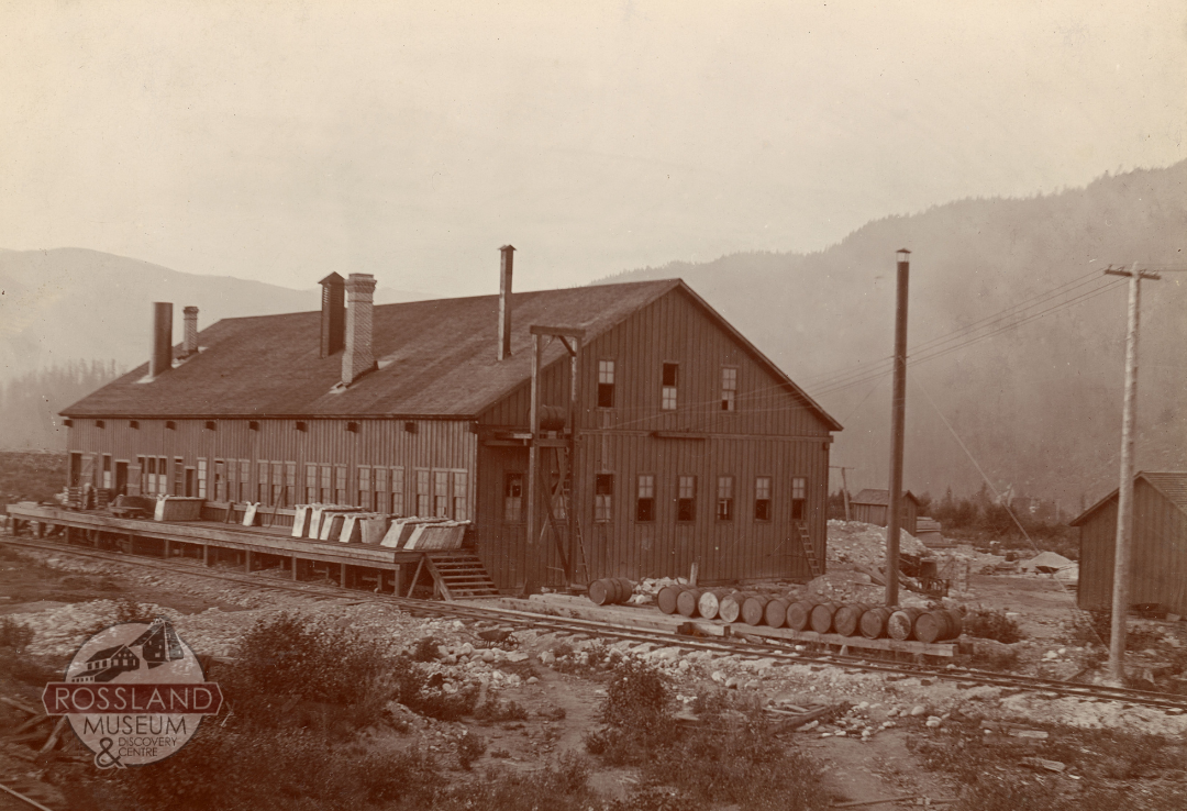 Black and white photograph of a large industrial building