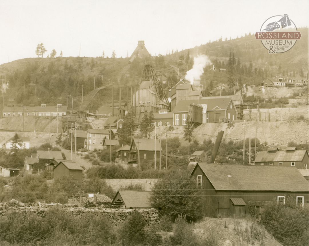 Sepia-toned photograph of mines on a mountain