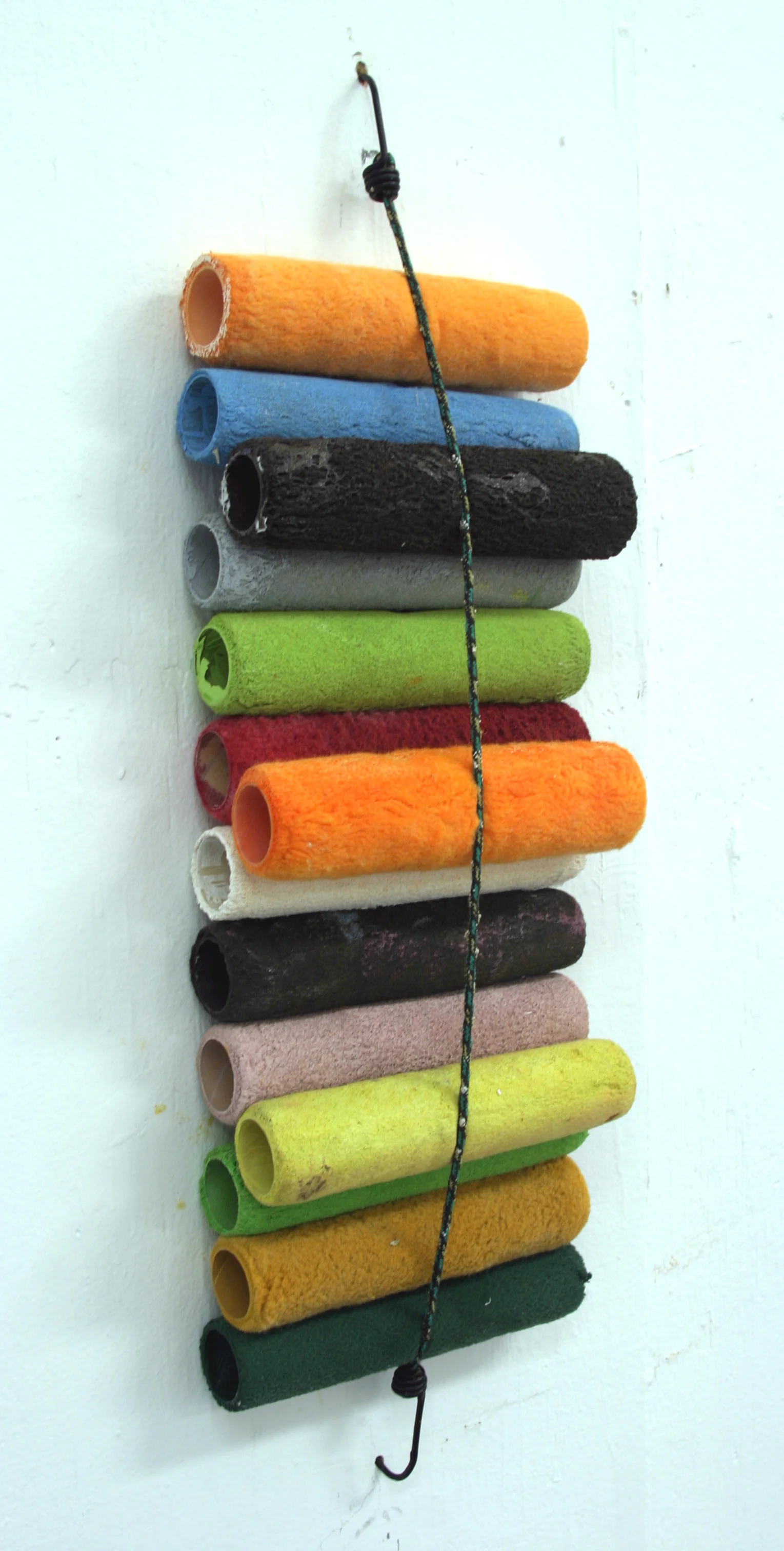 Strapping On , used paint roller pads, bungee cord, dims vary, 2004