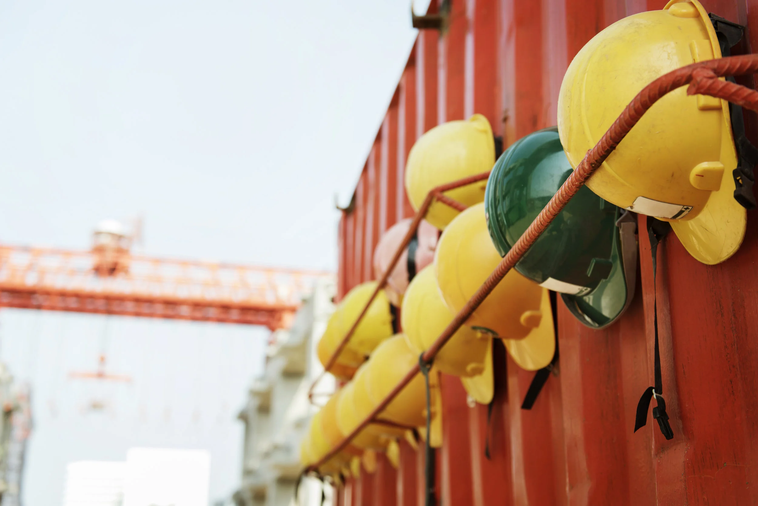 Closeup of variety of safety helmets row at construction site