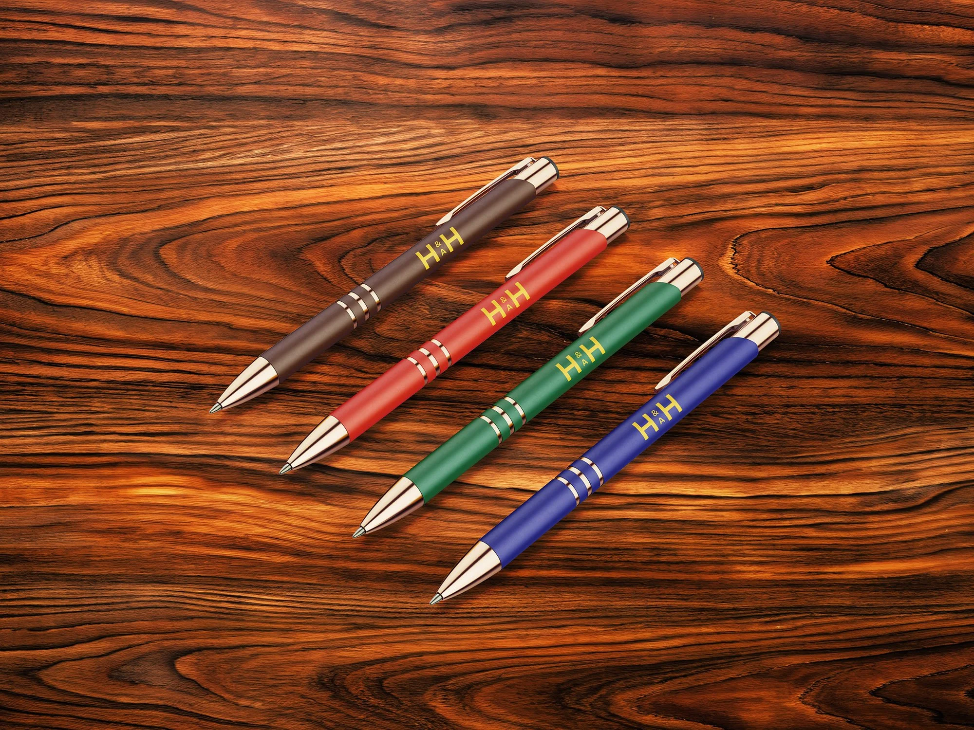 Mockup of desk pens with H&AH logo