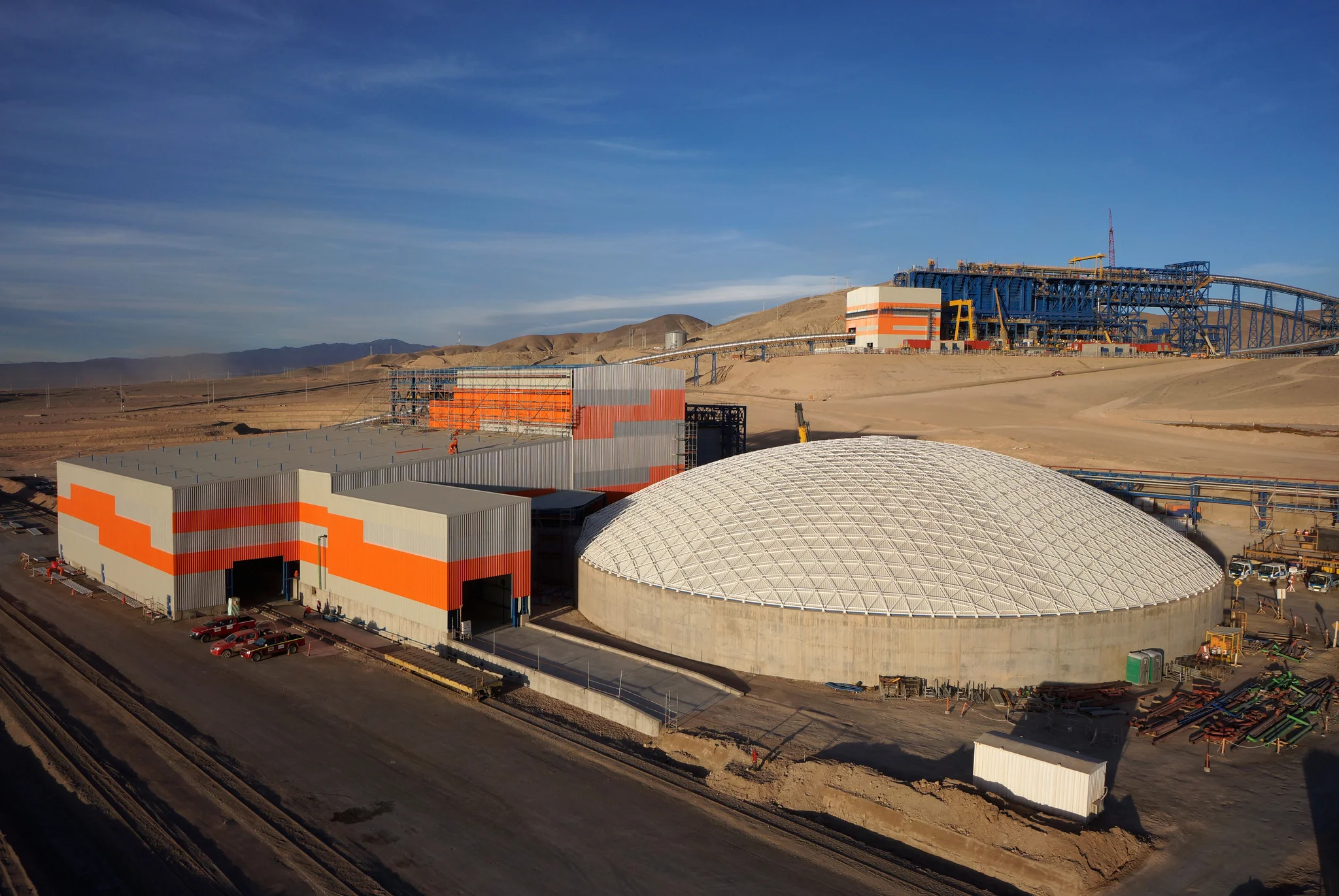 Foreground: a 62m concentrate storage dome. Background: a 122m copper ore storage dome