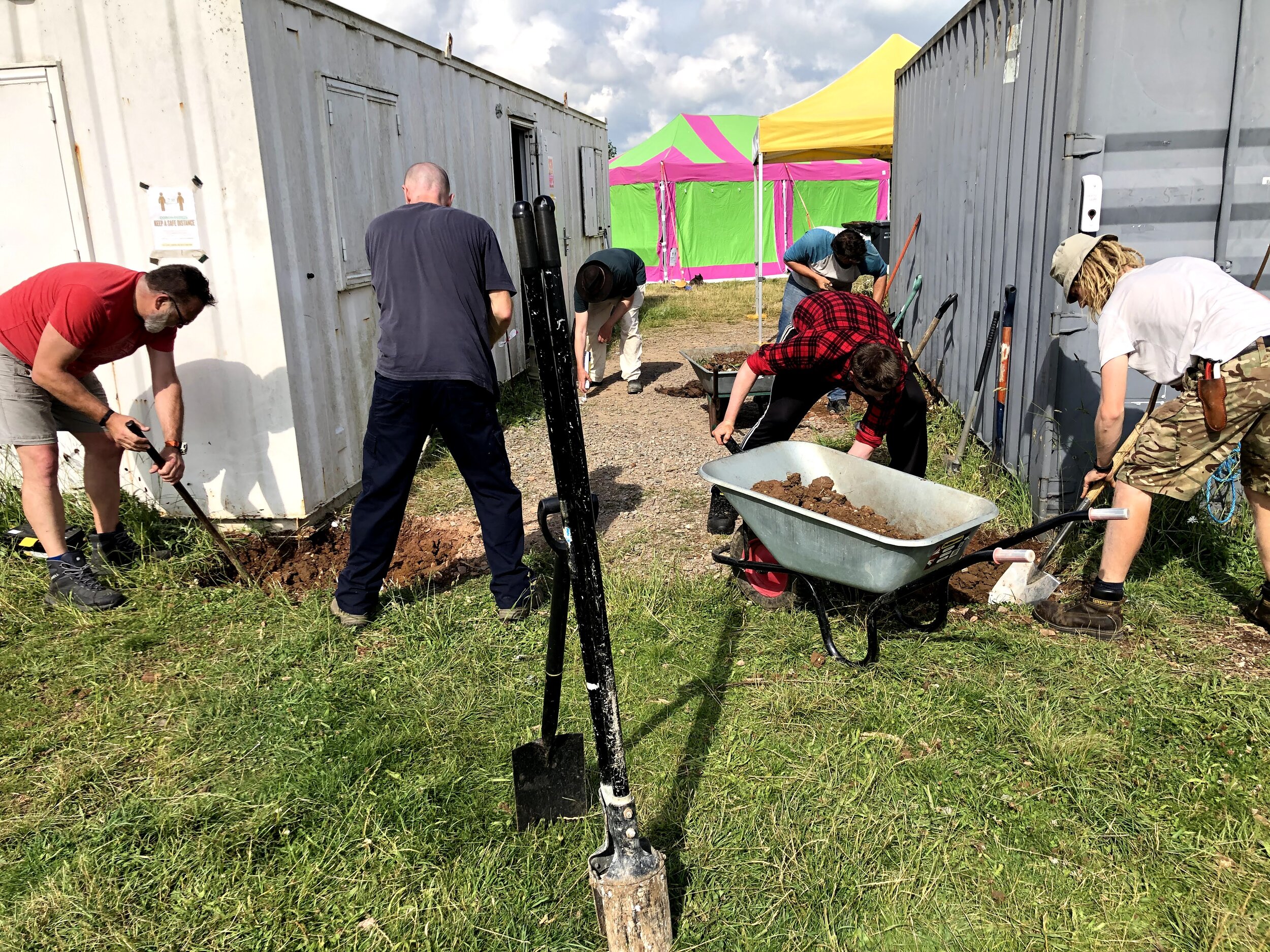 Hole digging - wonderful team of diggers excavate holes for 16 concrete pads to support the timber frame